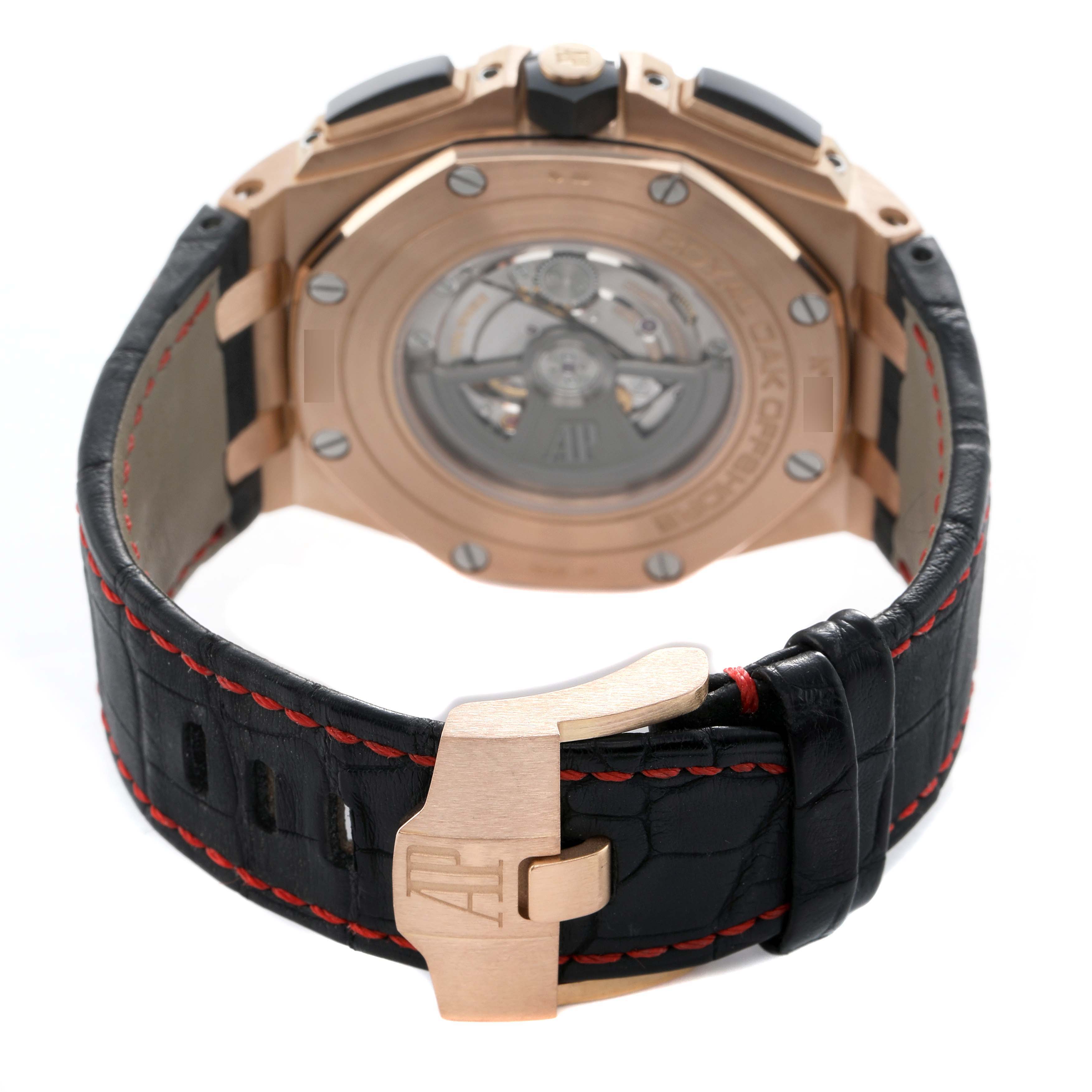 The image shows the back of an Audemars Piguet Royal Oak Offshore 26401RO Men's Rose Gold Black Dial, highlighting its case, clasp, and leather strap with red stitching.