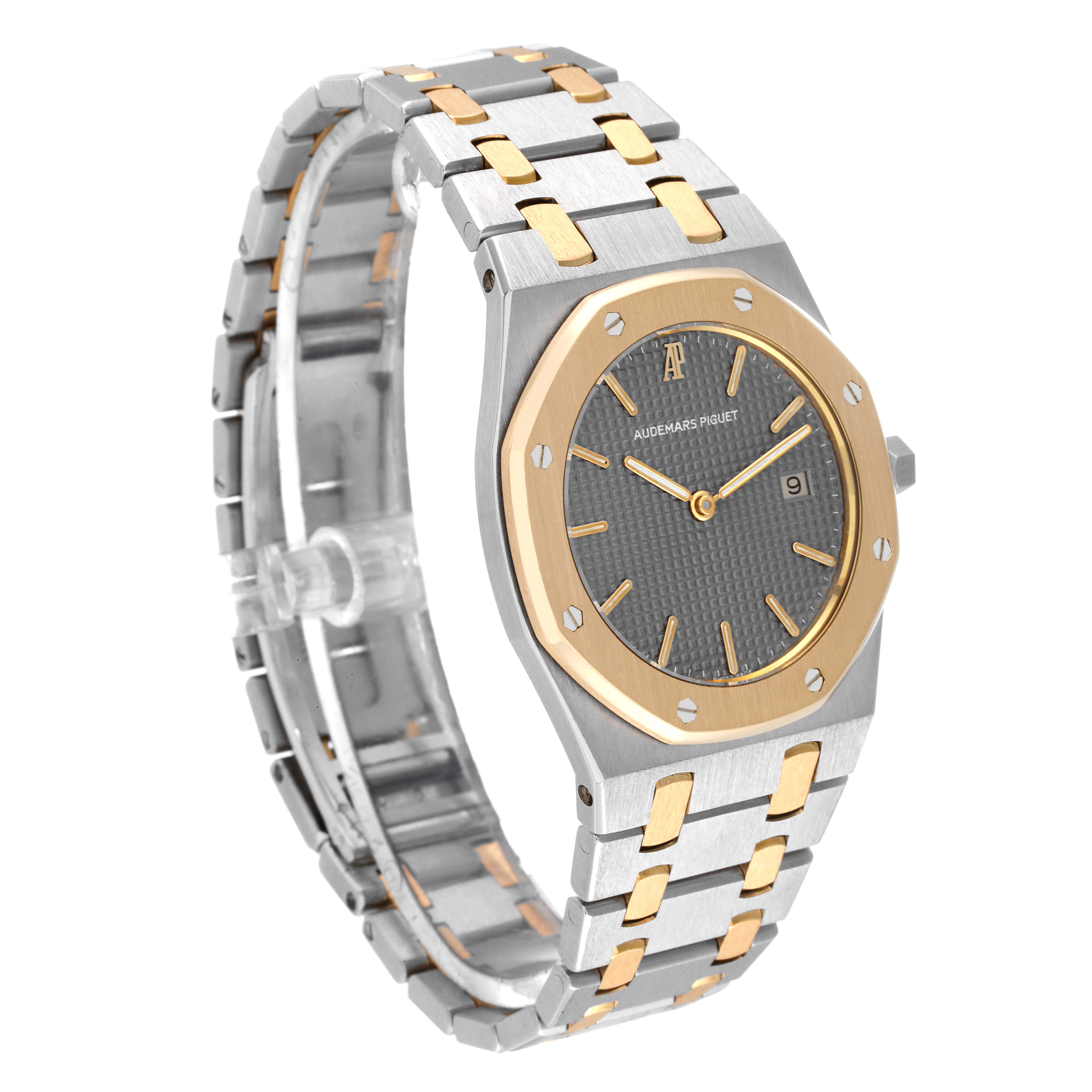 This image shows a side angle of the Audemars Piguet Royal Oak 56175SA.OO.0789SA.01 Men's Steel and Gold (two tone) Grey Dial 56175SA.OO.0789SA.01 Men's Steel and Gold (two tone) Grey Dial watch, highlighting its two-tone metal bracelet and octagonal bezel.