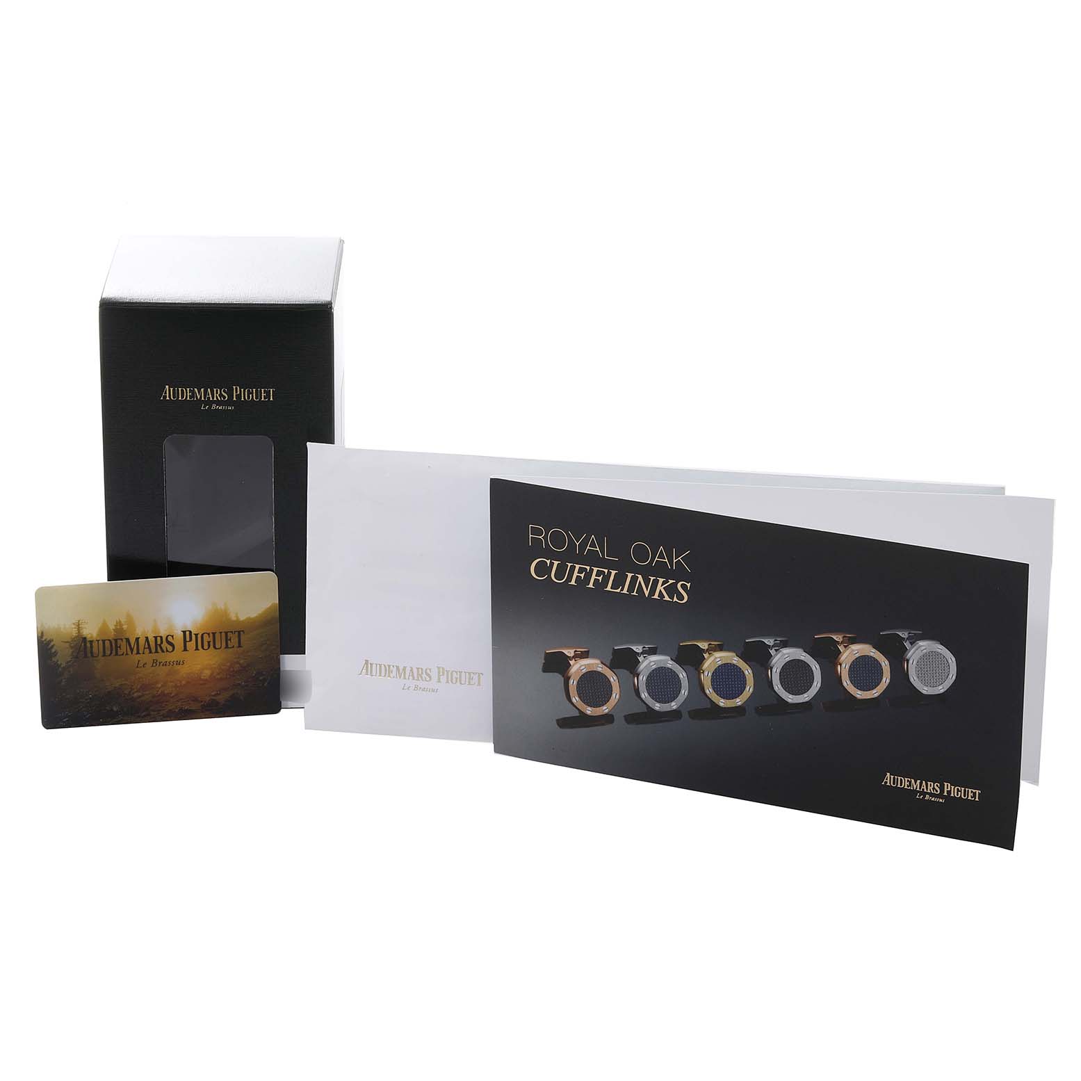 The image shows packaging materials, documentation, and informational cards related to Royal Oak cufflinks by Audemars Piguet.