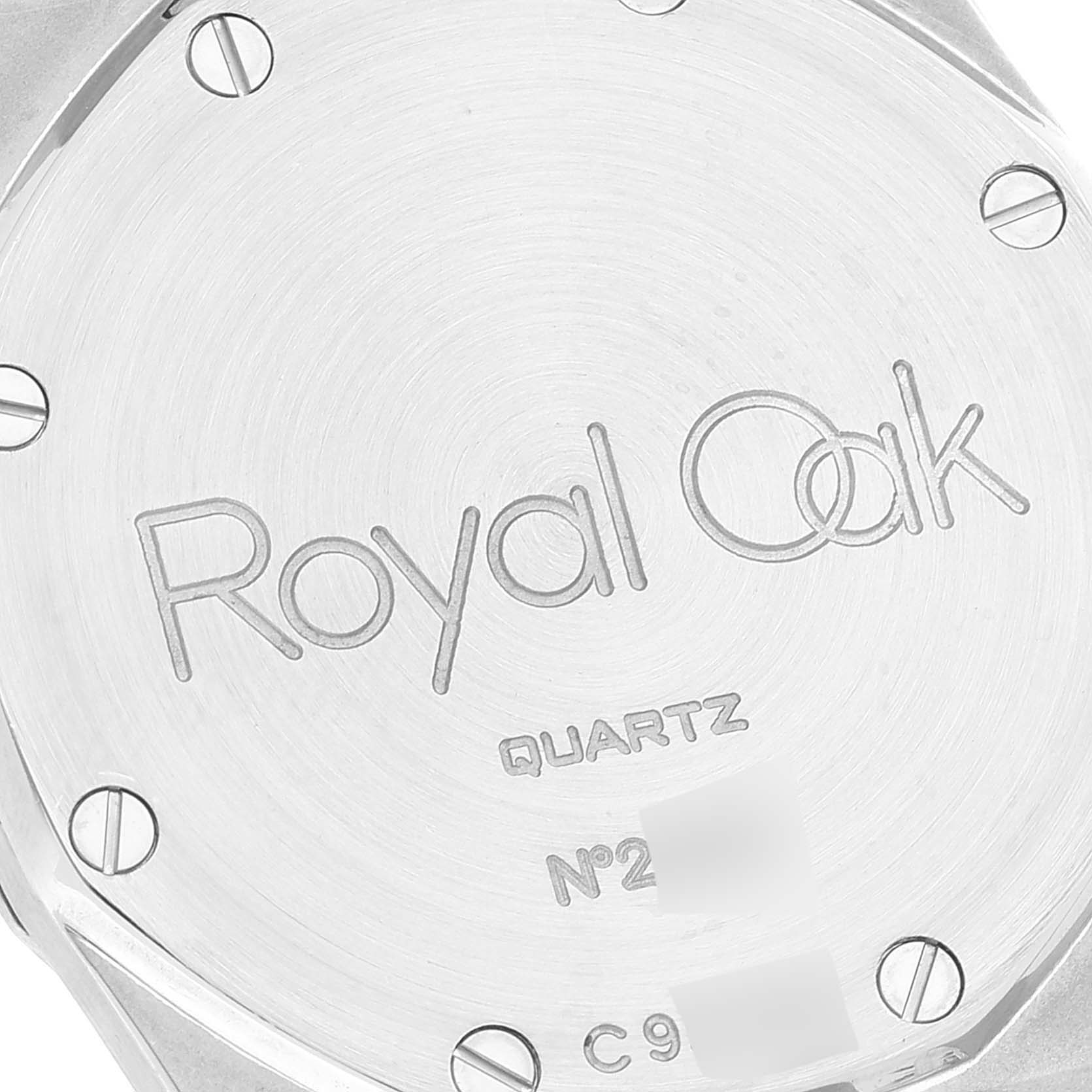 This image shows the backside of an Audemars Piguet Royal Oak 56175SA.OO.0789SA.01 Men's Steel and Gold (two tone) Grey Dial 56175SA.OO.0789SA.01 Men's Steel and Gold (two tone) Grey Dial quartz model, highlighting the engraved case back and visible screws.