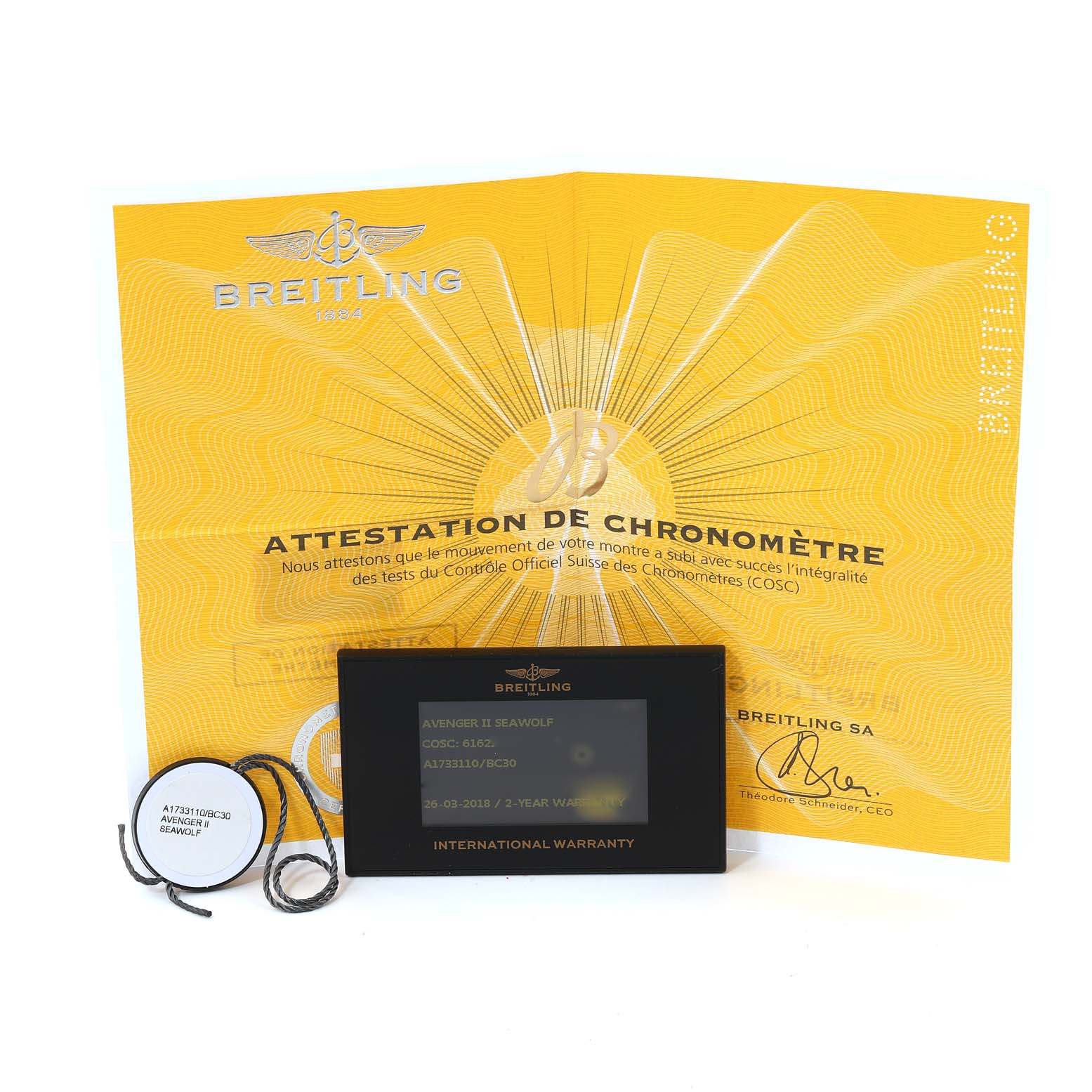 The image shows the certification, international warranty card, and accessory tags of a Breitling Avenger A17331 Men's Stainless Steel Black Dial A17331 Men's Stainless Steel Black Dial model watch.