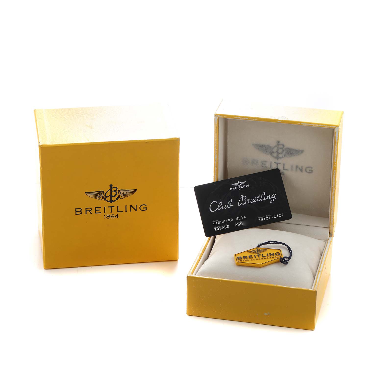 The image shows Breitling Chronomat A44360 Men's Stainless Steel Black Dial packaging including the box, a "Club Breitling" card, and a tag inside the open watch box.
