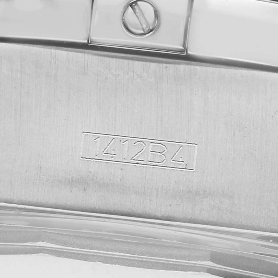 The image shows a close-up of the clasp area of the Breitling Chronomat A44360 Men's Stainless Steel Black Dial watch, featuring a screw and engraved numbers.