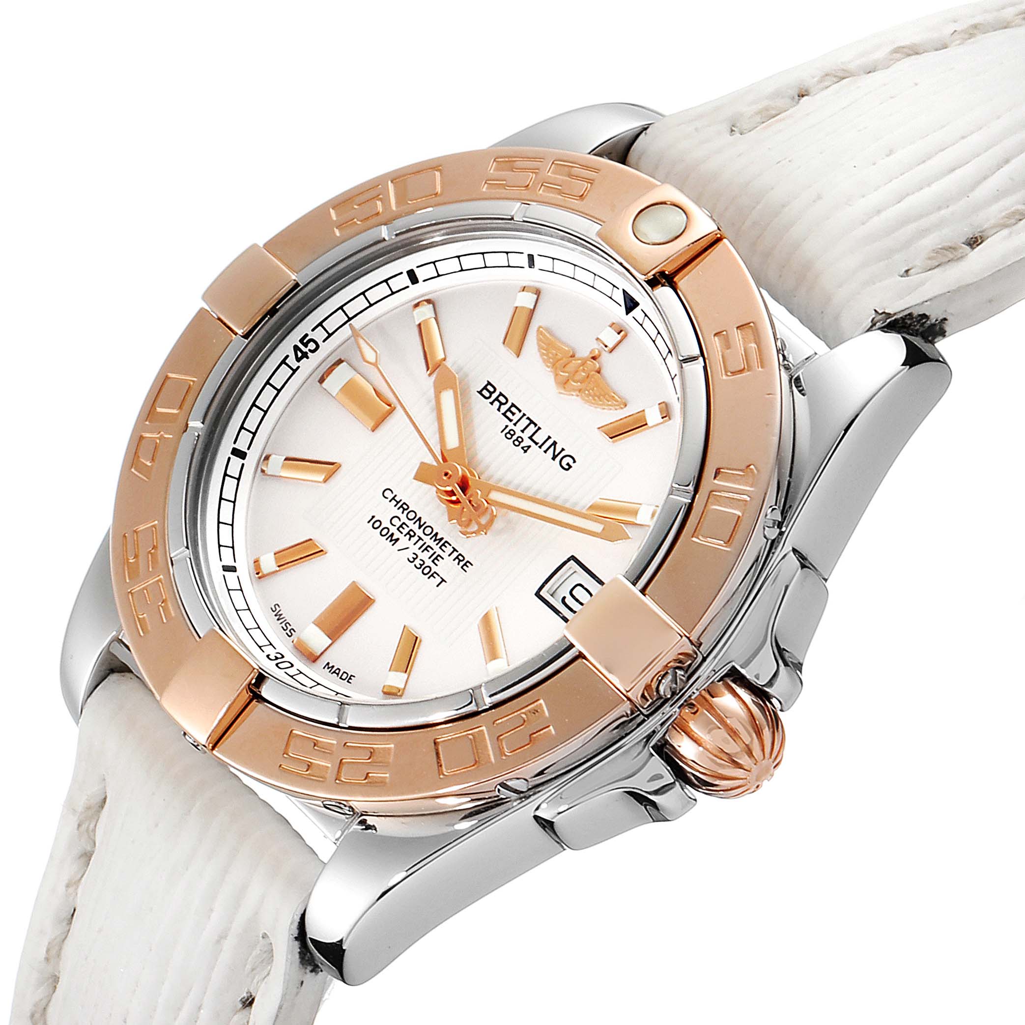 The image shows a close-up angle of the Breitling C71356 Women's Steel and Gold (two tone) Silver Dial C71356 Women's Steel and Gold (two tone) Silver Dial Galactic 32 Steel Rose Gold White Strap Ladies Watch C71356, featuring its face and crown.