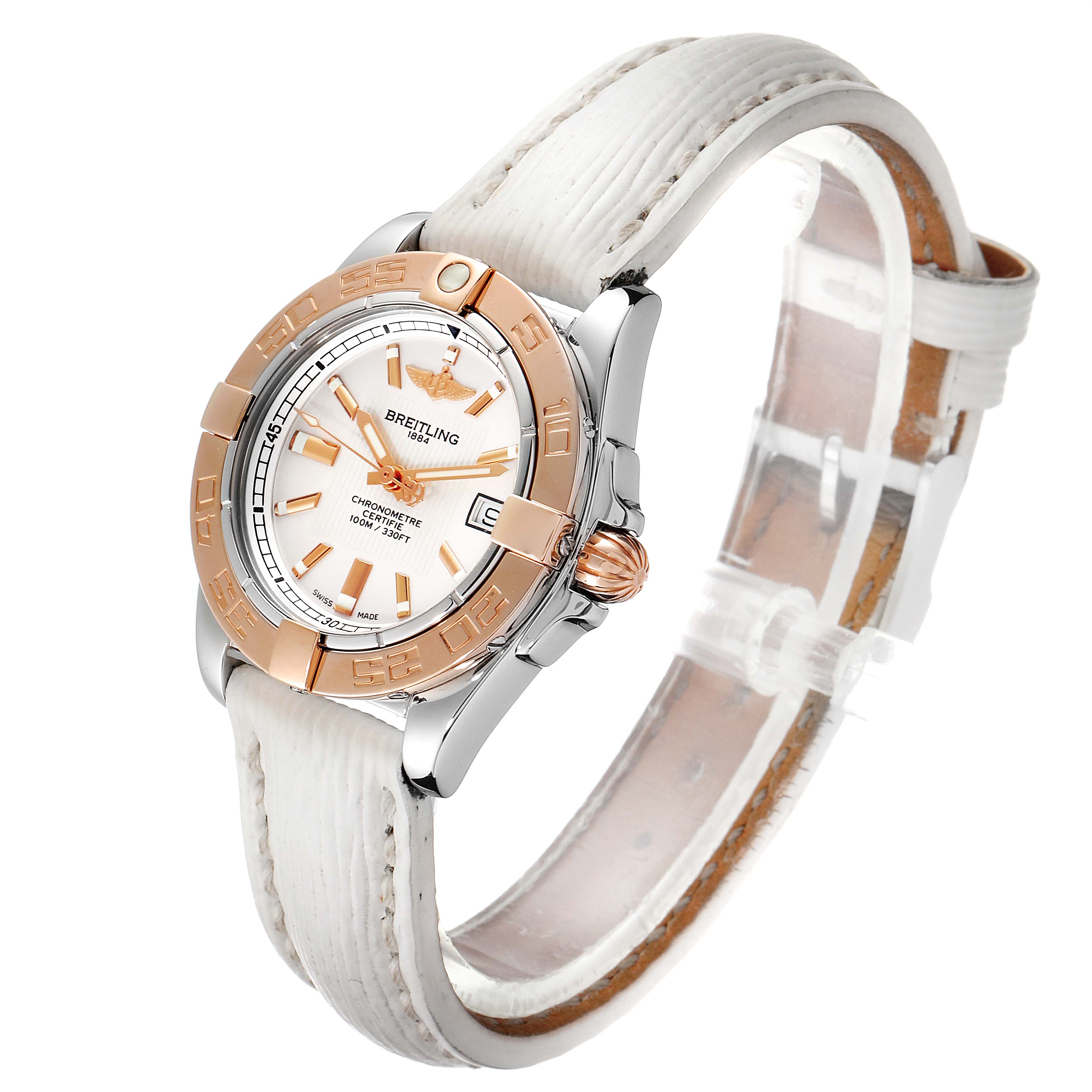 The Breitling C71356 Women's Steel and Gold (two tone) Silver Dial C71356 Women's Steel and Gold (two tone) Silver Dial Galactic 32 Steel Rose Gold White Strap Ladies Watch C71356 is shown at an angled view, highlighting the face, bezel, and strap.