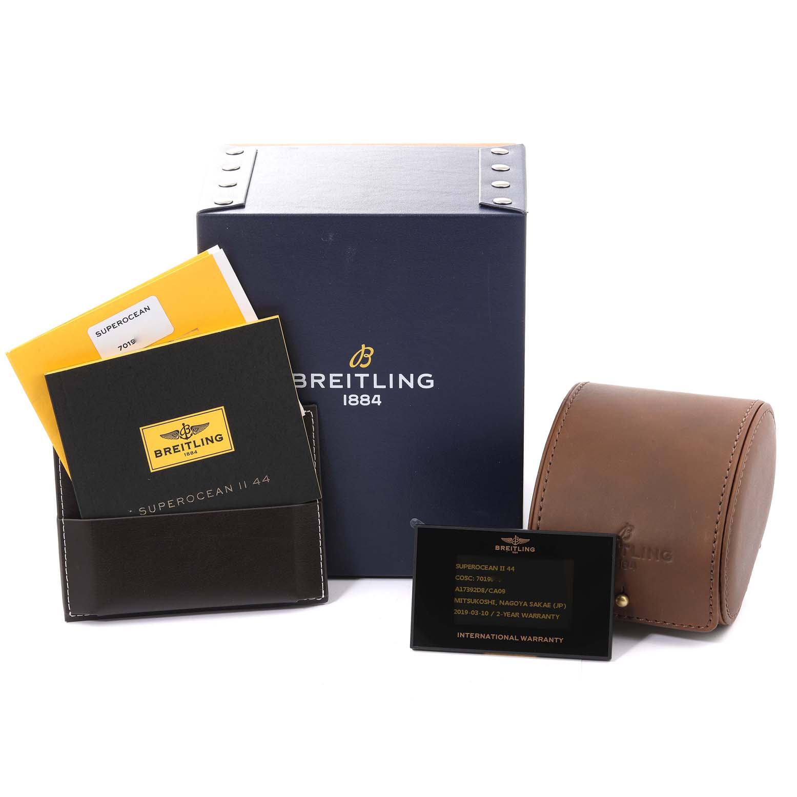 The image shows a Breitling Superocean A17392 Men's Stainless Steel Blue Dial A17392 Men's Stainless Steel Blue Dial watch box, warranty card, manual, leather pouch, and original packaging accessories.