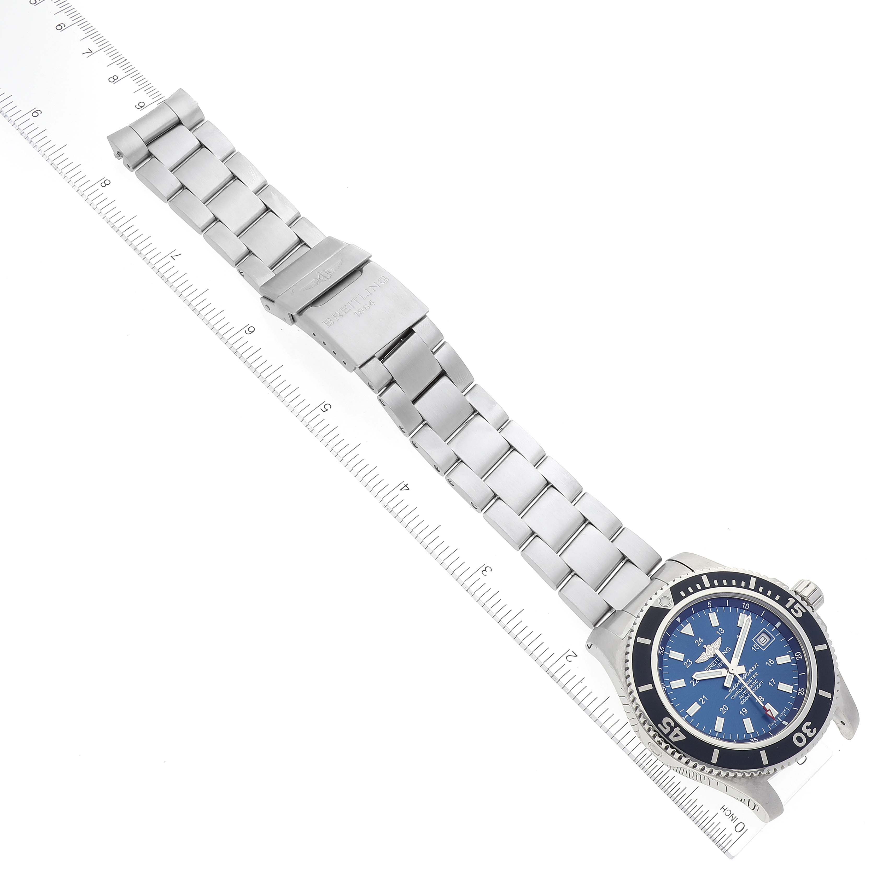 The Breitling Superocean A17392 Men's Stainless Steel Blue Dial A17392 Men's Stainless Steel Blue Dial watch is shown flat, displaying the blue dial, bezel, bracelet, and clasp, aligned with a ruler.