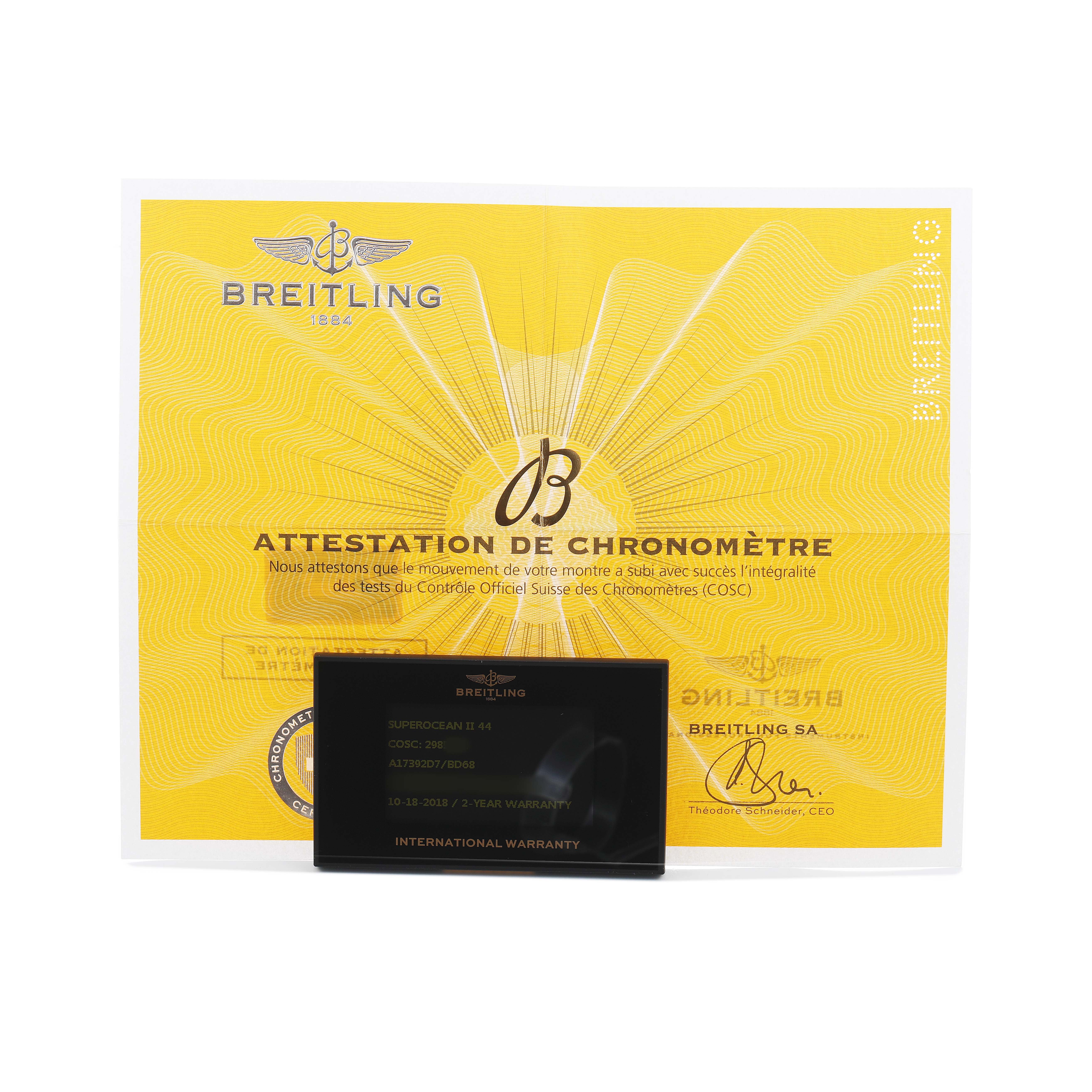 The image shows a Breitling Superocean A17392 Men's Stainless Steel Black Dial certificate and warranty card from a front angle.