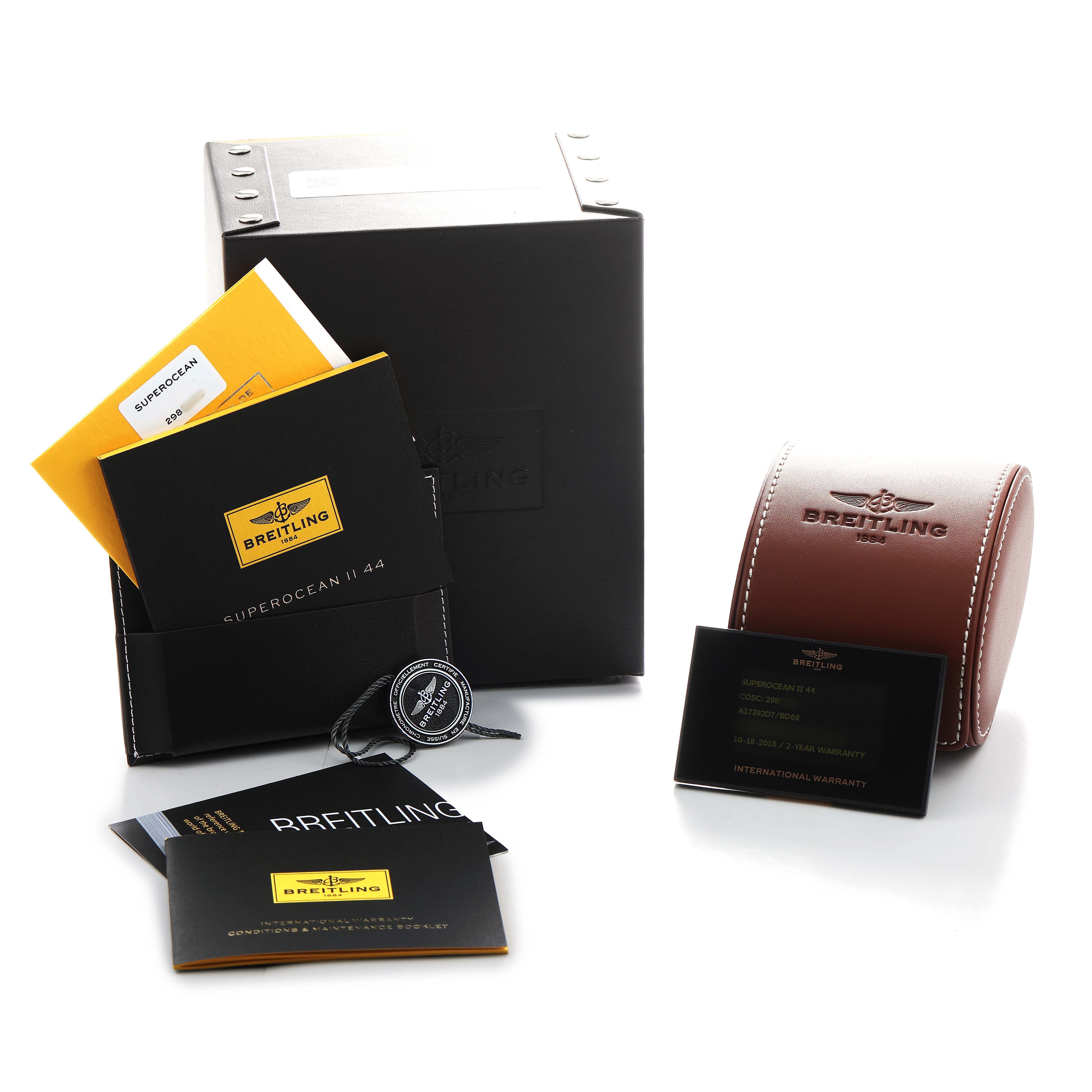 The image shows the Breitling Superocean A17392 Men's Stainless Steel Black Dial packaging, including a box, leather case, manuals, and warranty card, all viewed from an angle.