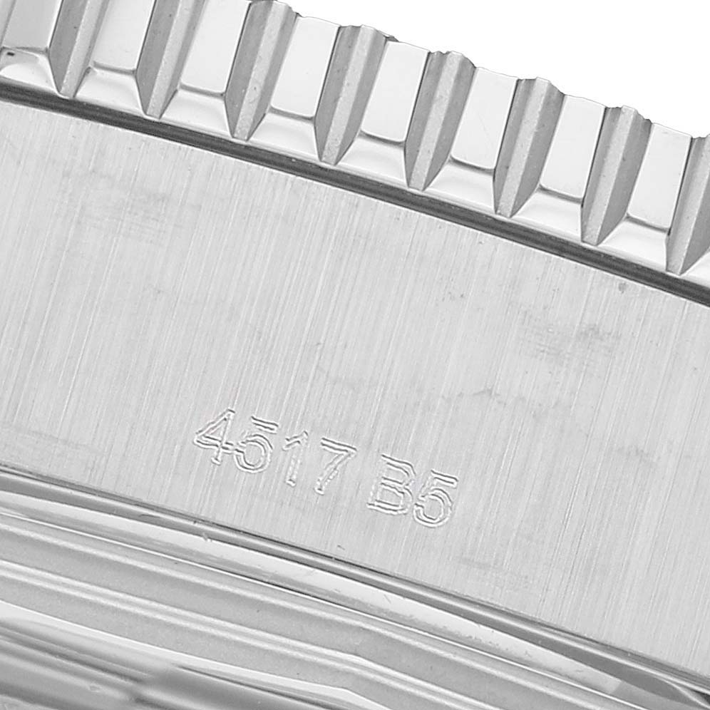 The image shows a close-up of the side of a Breitling Superocean A17392 Men's Stainless Steel Black Dial watch, highlighting its textured bezel and engraved numbers.