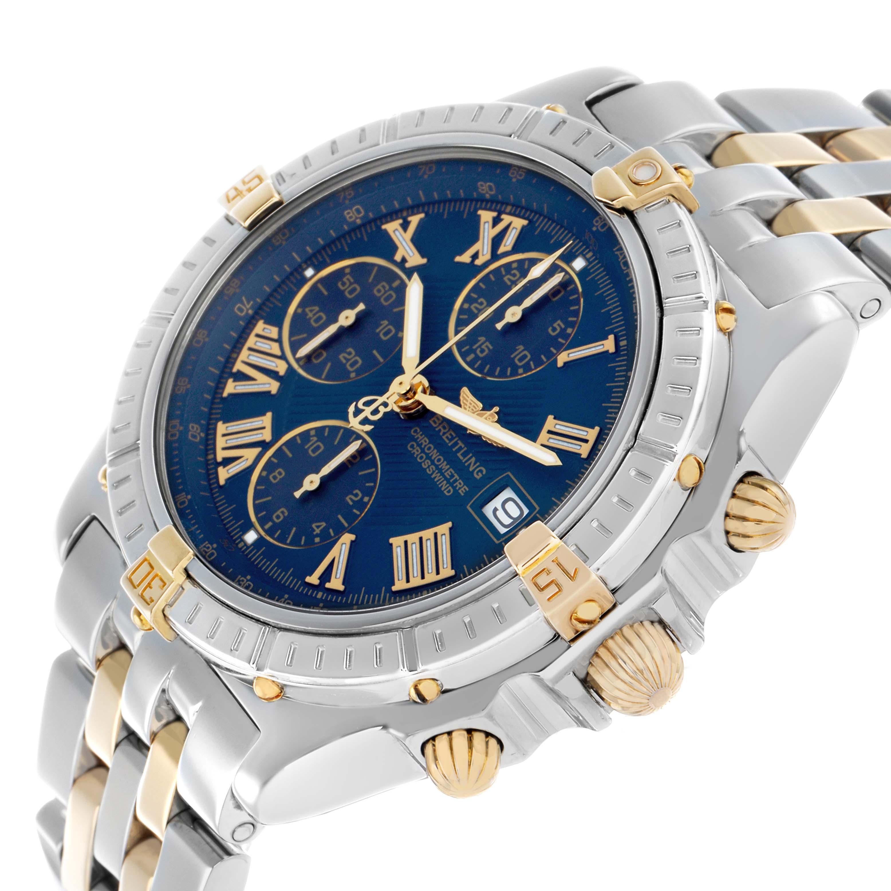 The Breitling Windrider B13355 Men's Steel and Gold (two tone) Blue Dial watch is shown at an angled view, displaying its blue dial, Roman numerals, bezel, and two-tone bracelet.