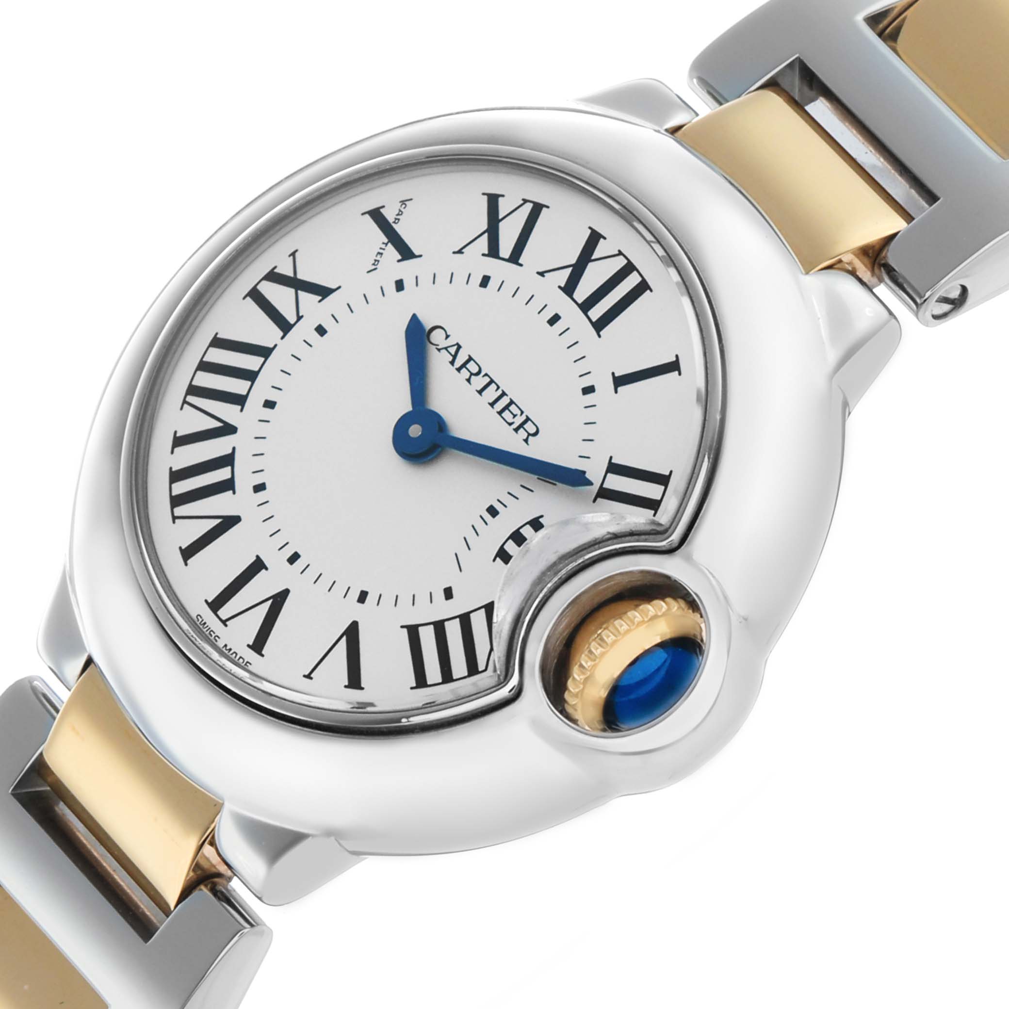 The Cartier Ballon Bleu W69007Z3 Women's Stainless Steel Silver Dial watch is shown at an angle highlighting its Roman numeral dial, crown, and part of the metal strap.