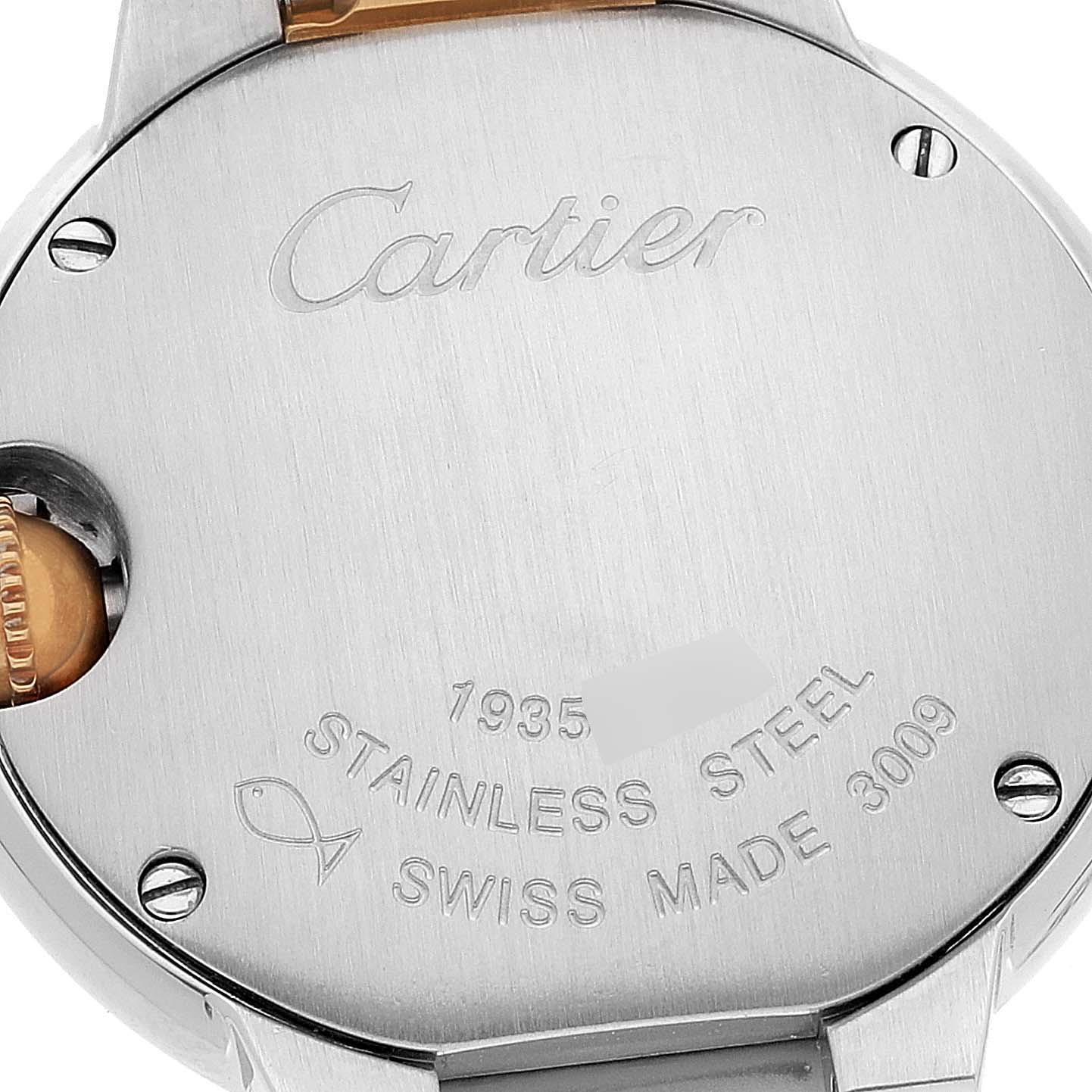 This image shows the back of a Cartier Ballon Bleu W69007Z3 Women's Steel and Gold (two tone) Silver Dial W69007Z3 Women's Steel and Gold (two tone) Silver Dial watch, featuring engravings and part of the stainless steel case.