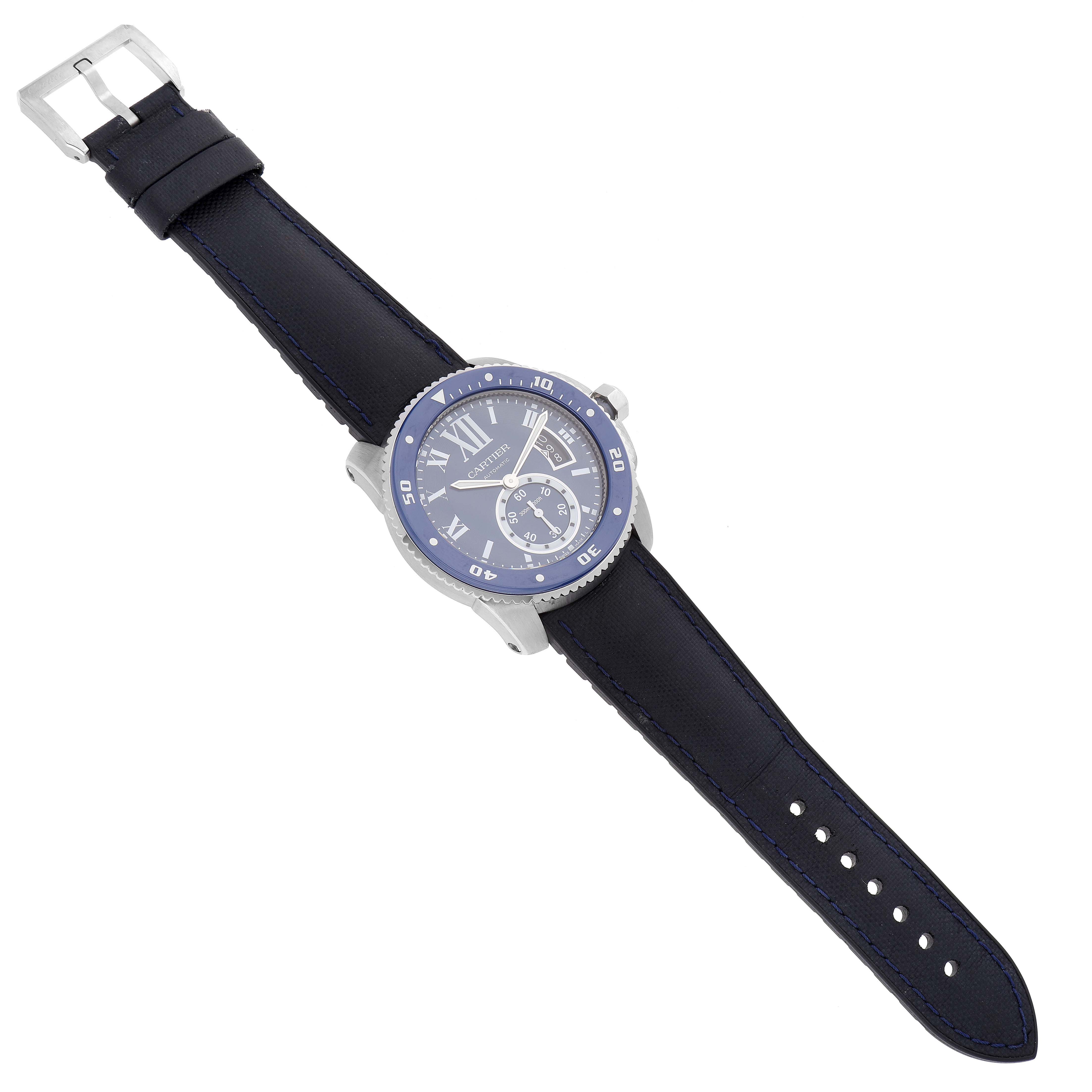 The image shows a Calibre de Cartier watch by Cartier, displayed at a slight angle showcasing its face, strap, and buckle.