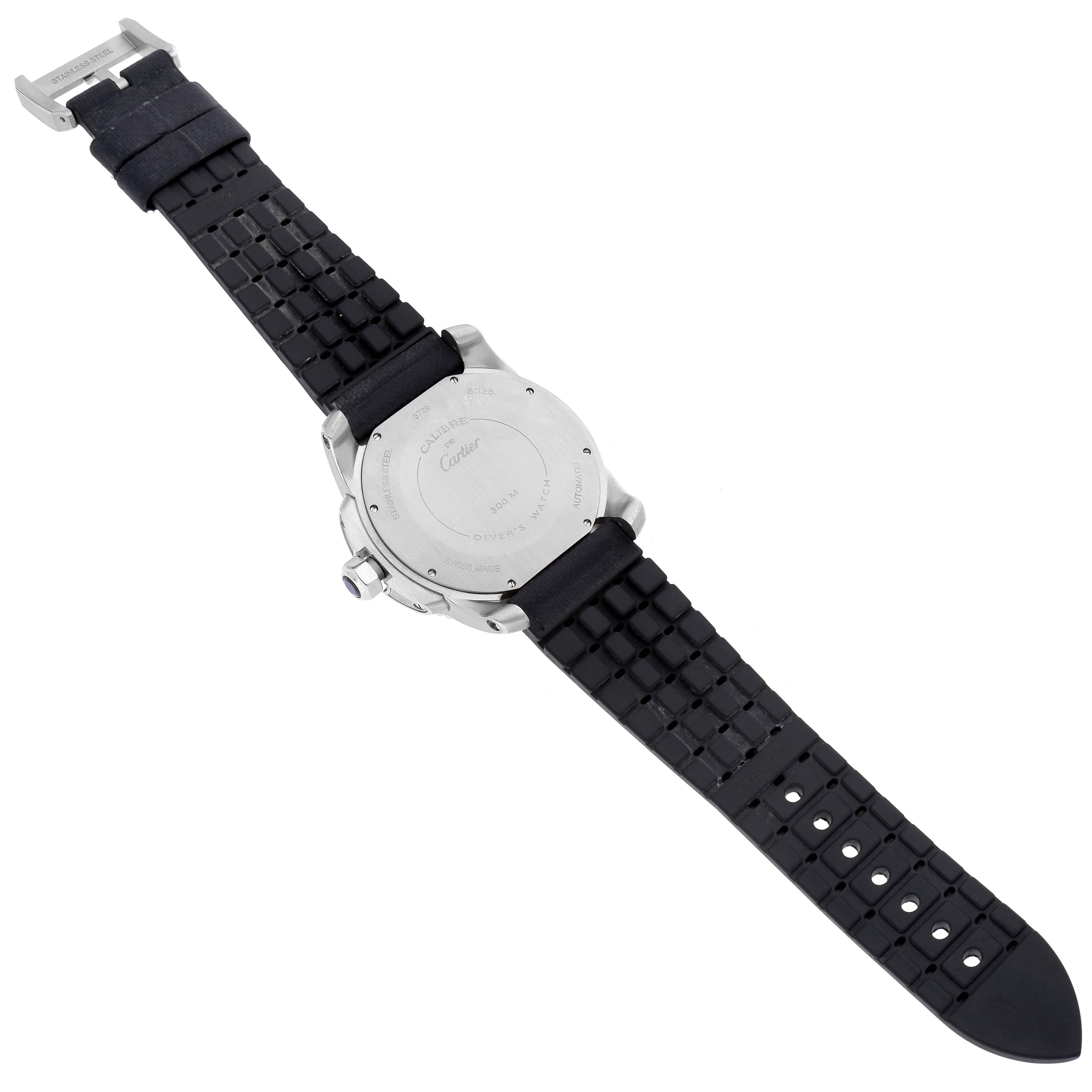 The image shows the back and strap of the Calibre de Cartier watch by Cartier, taken at an oblique angle.