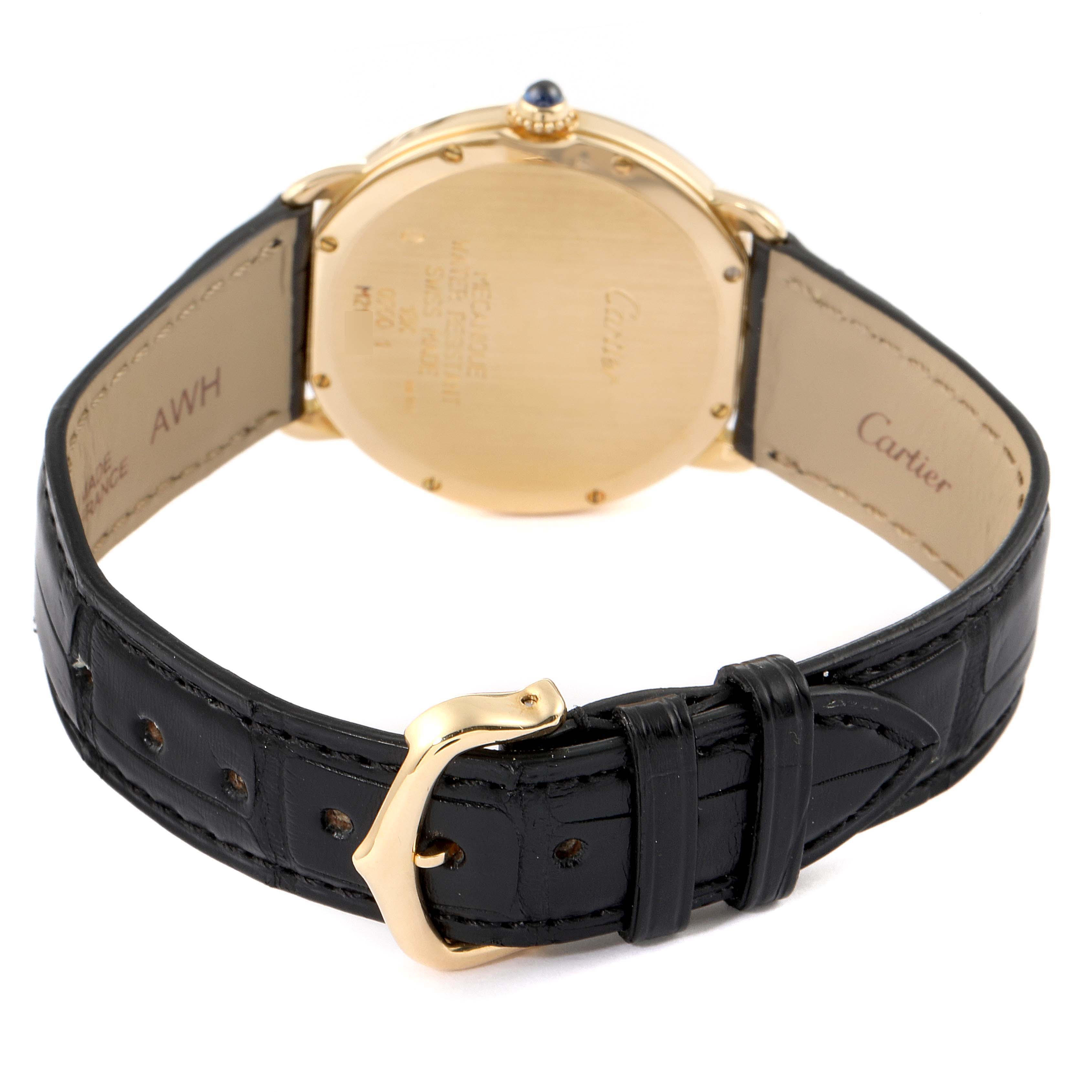 This image shows the back of a Cartier Ronde 09001 Men's Yellow Gold Silver Dial 09001 Men's Yellow Gold Silver Dial watch with a leather strap and a gold buckle.