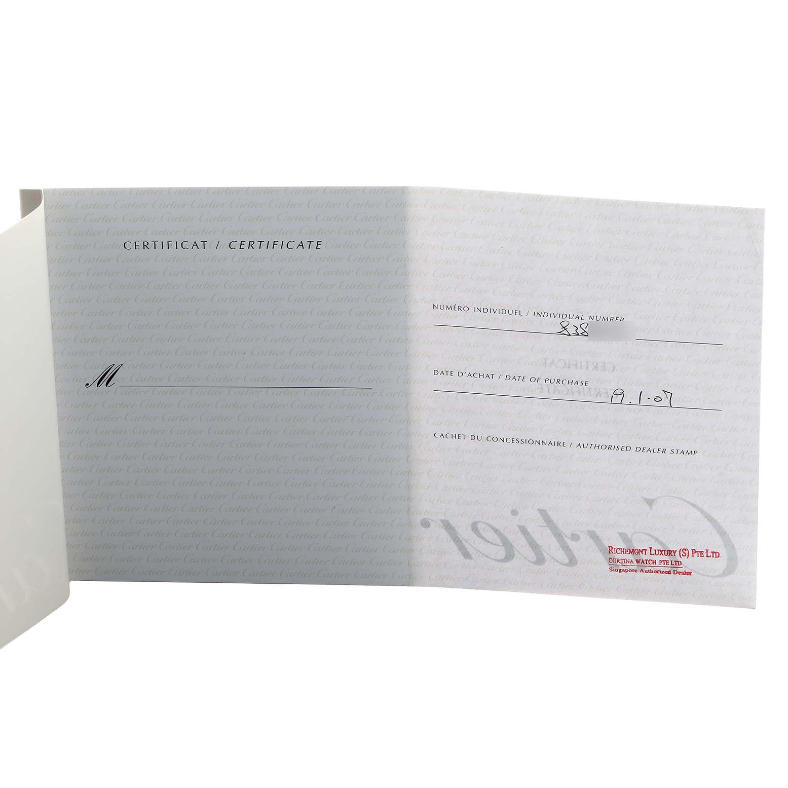 The image shows an open certificate booklet for the Cartier Santos Demoiselle WF9001Y7 Women's Yellow Gold Silver Dial, displaying purchase details and dealer stamp.