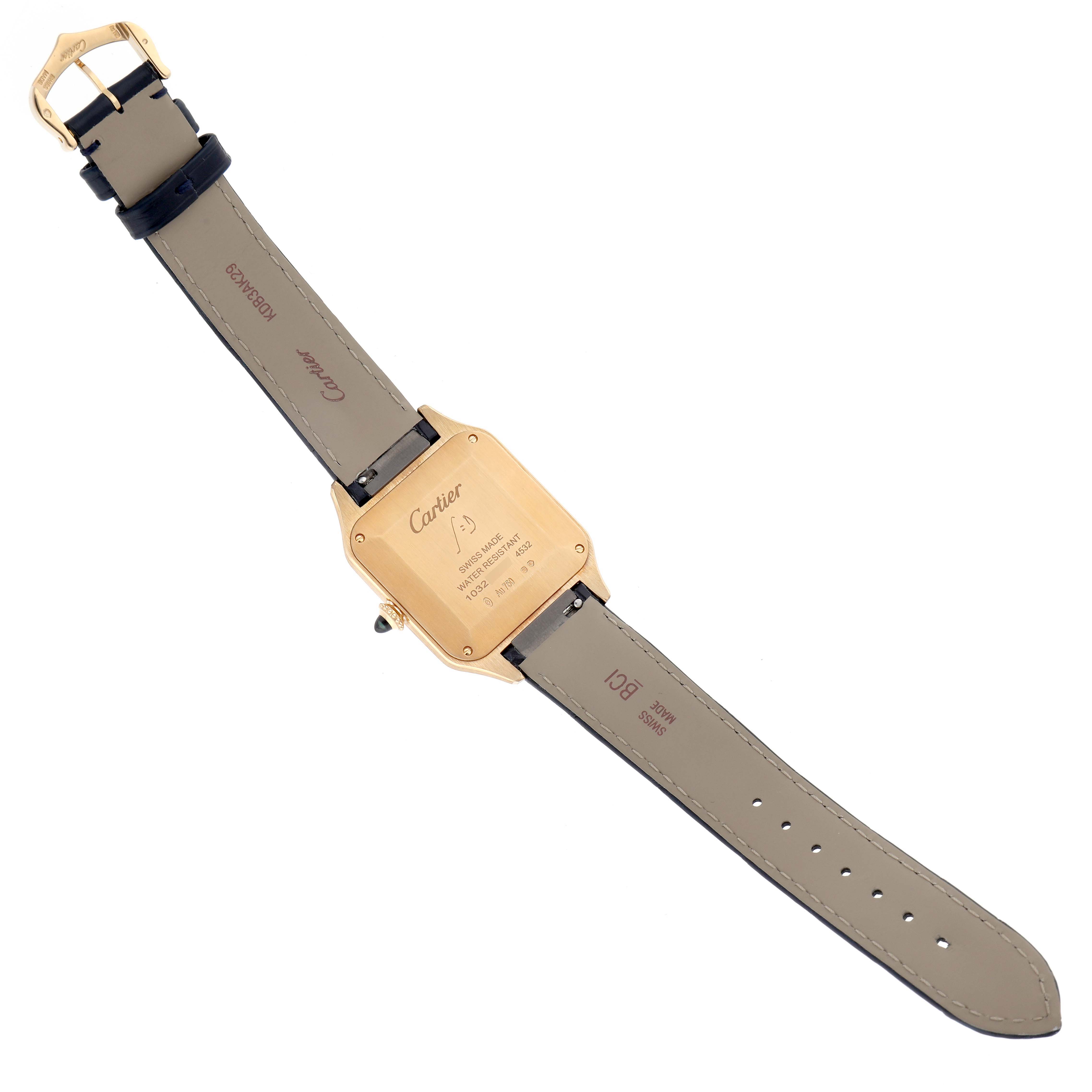 The image shows the back and strap of a Cartier Santos Dumont WGSA0077 Men's Yellow Gold Black Dial WGSA0077 Men's Yellow Gold Black Dial watch lying flat, detailing the case back and leather strap.