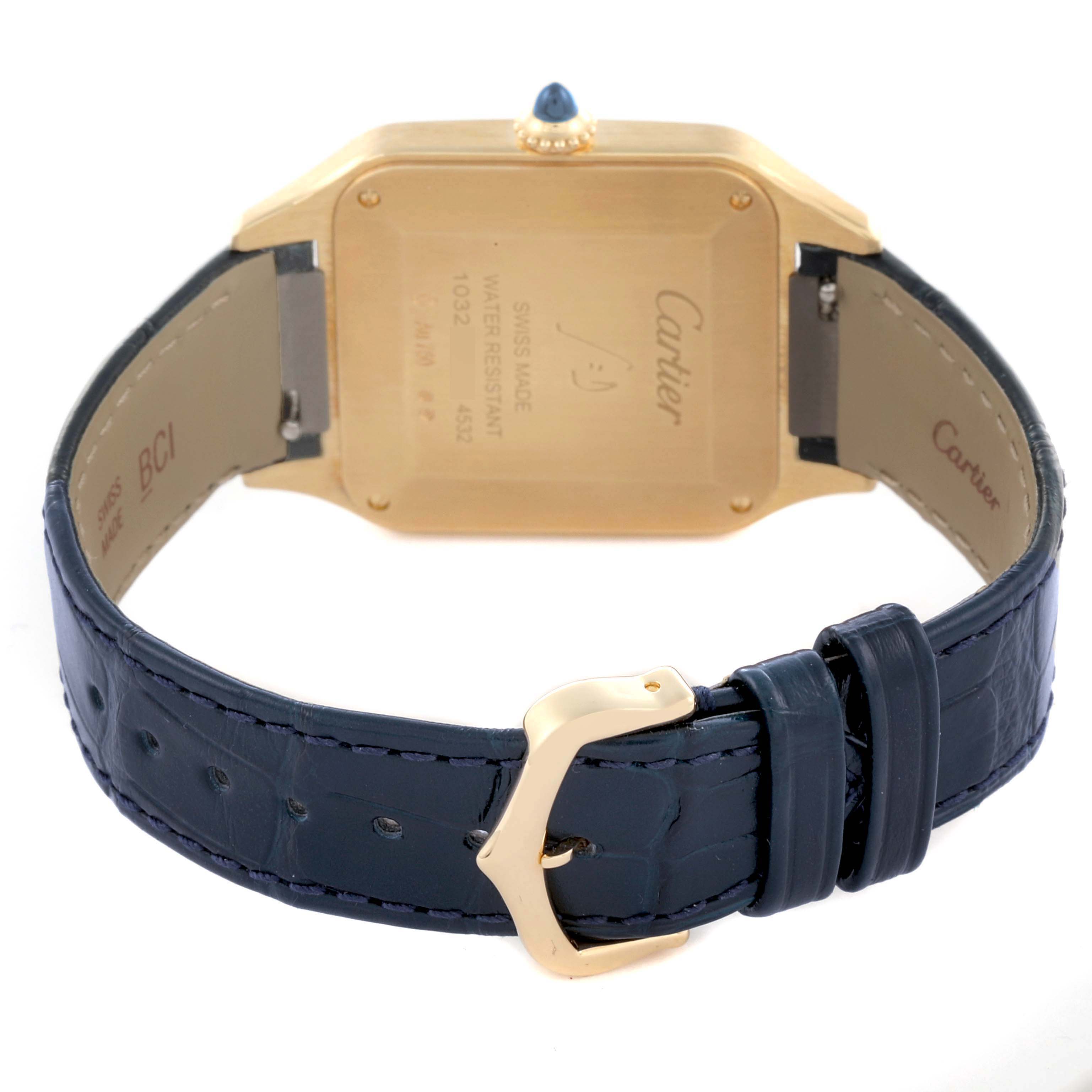 The image shows the back of the Cartier Santos Dumont WGSA0077 Men's Yellow Gold Black Dial WGSA0077 Men's Yellow Gold Black Dial watch, featuring its case back, crown, and blue leather strap with a gold buckle.