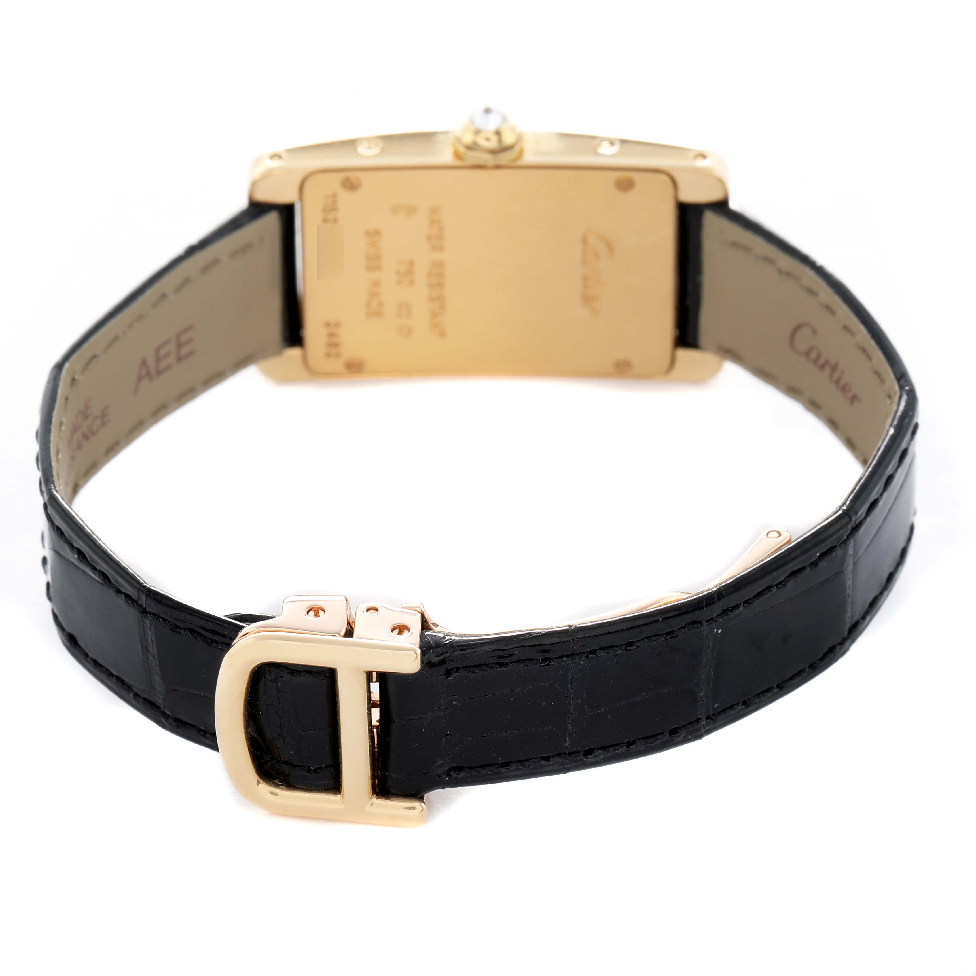 The image shows the reverse side of a Cartier Tank Americaine WB707231 Women's Yellow Gold Silver Dial, highlighting the case back, crown, and black leather strap.