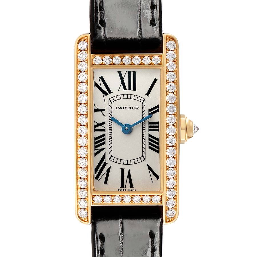 The Cartier Tank Americaine WB707231 Women's Yellow Gold Silver Dial watch is shown from a front view, displaying its rectangular face, Roman numerals, leather strap, and diamond-studded bezel.