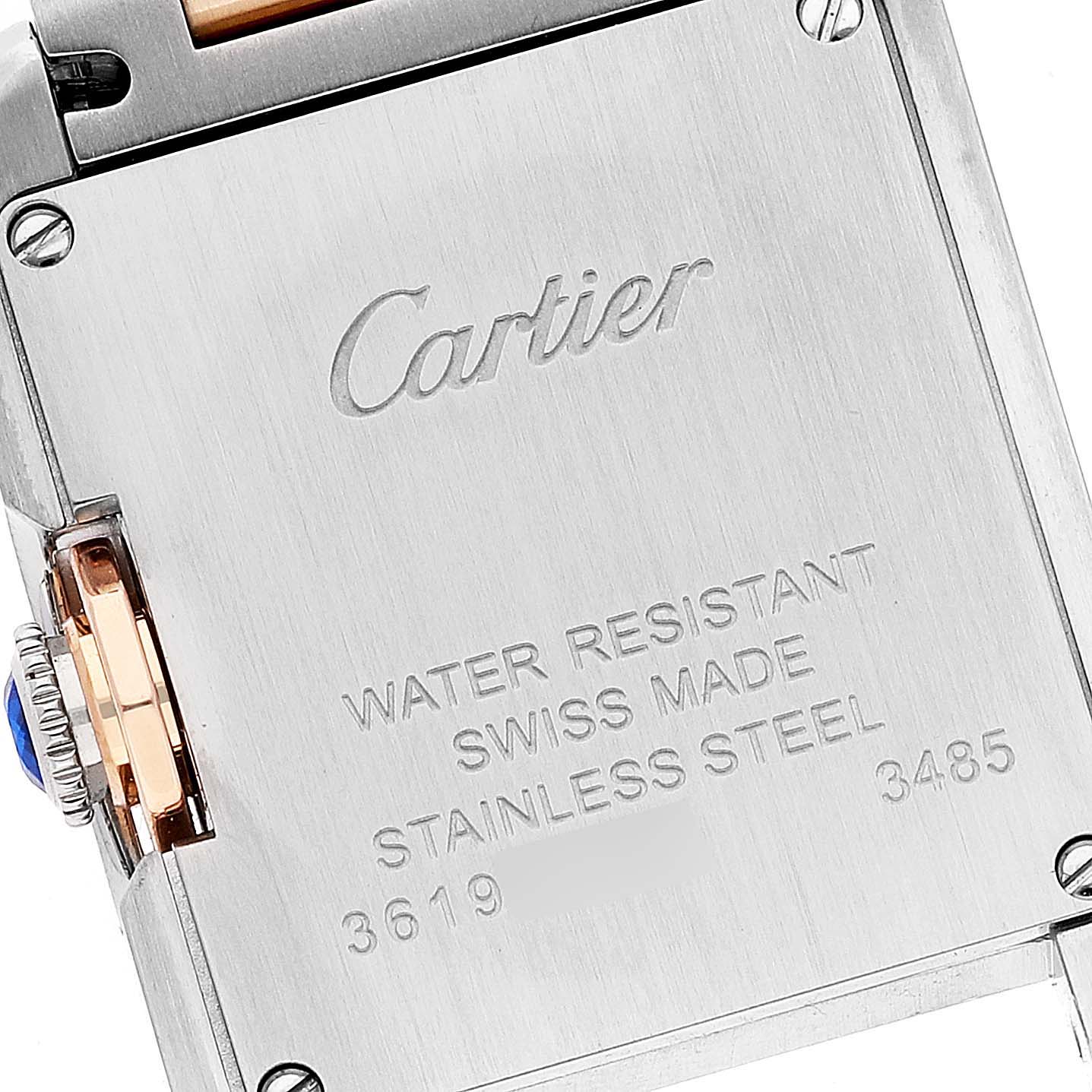 The image shows the back casing of the Cartier Tank Anglaise W5310036 Women's Steel and Gold (two tone) Silver Dial W5310036 Women's Steel and Gold (two tone) Silver Dial watch, highlighting the engravings and part of the crown.