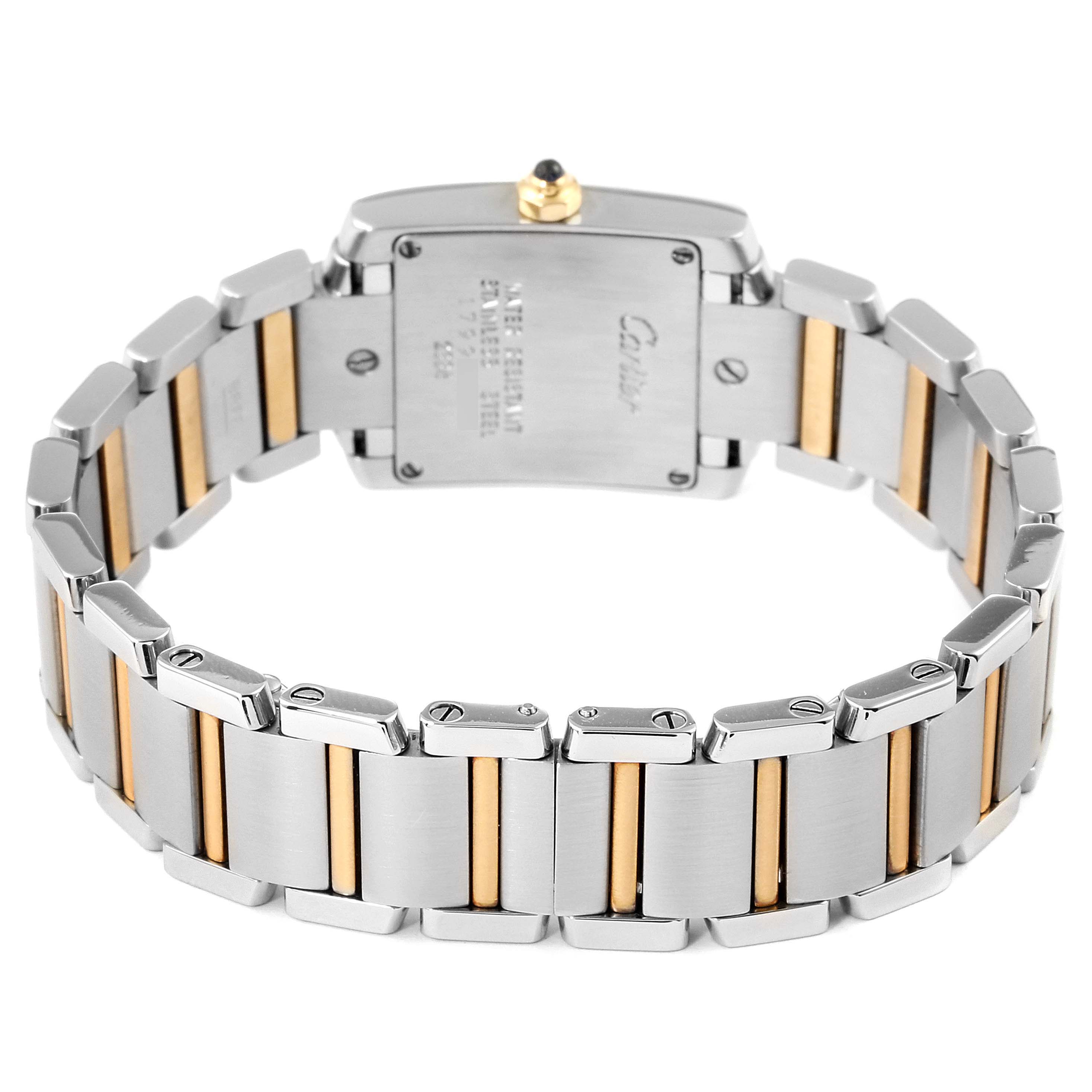 The image shows the back view of a Cartier Tank Française watch, highlighting its stainless steel and gold bracelet links.