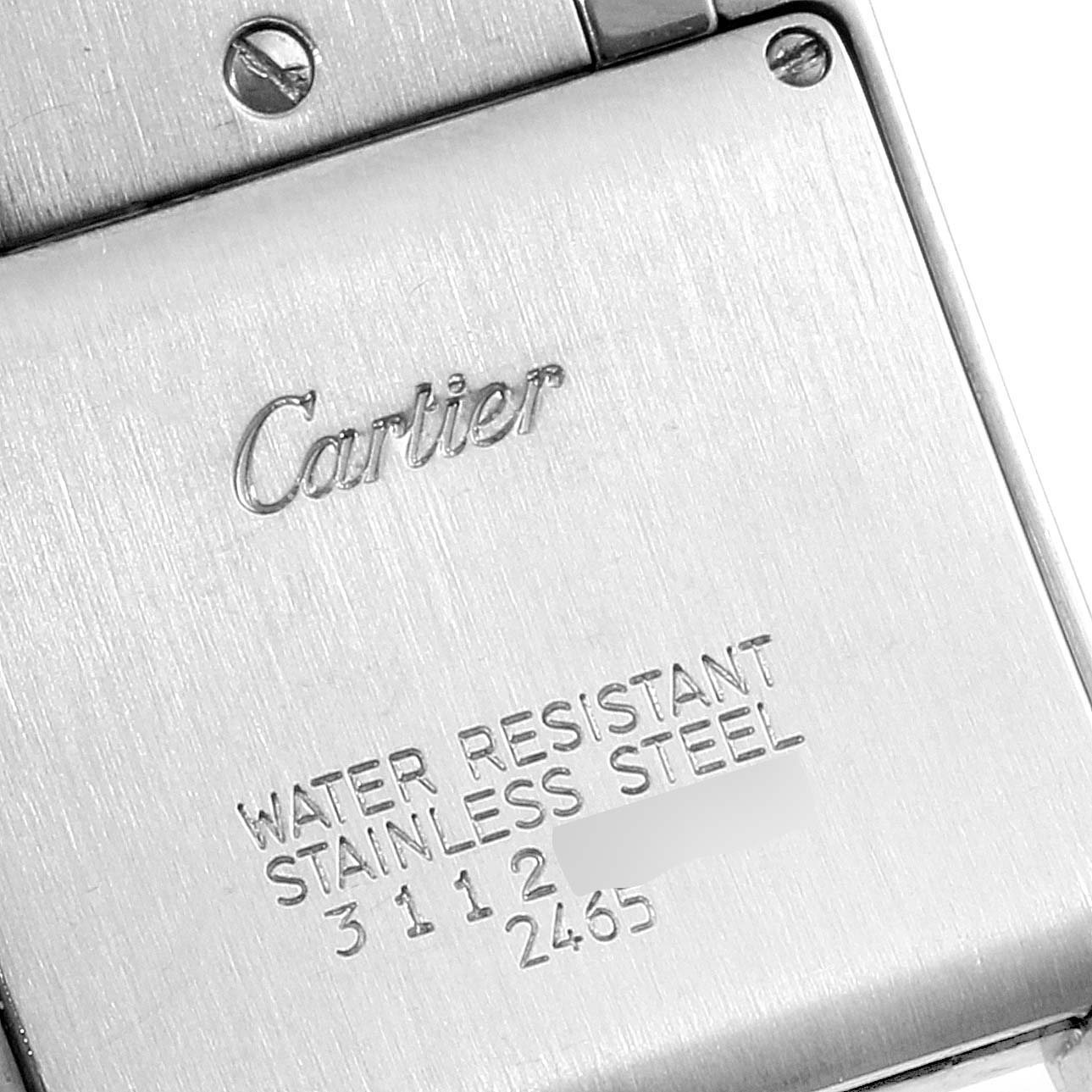 The image shows the back of a Tank Francaise watch by Cartier, highlighting the brand engraving and water resistance details.