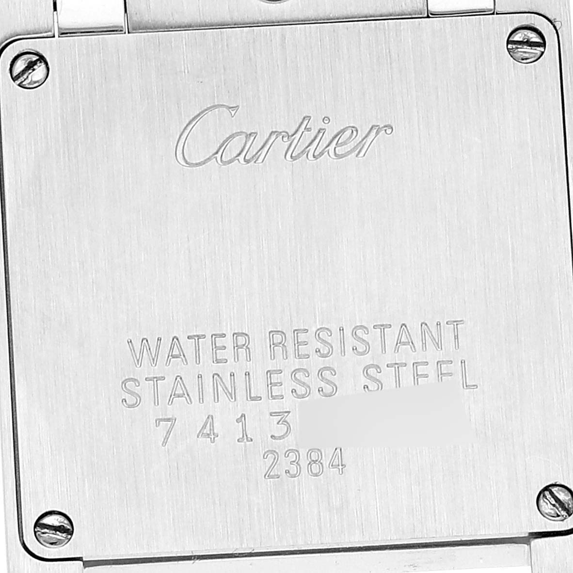 This image shows the back panel of a Cartier Tank Française watch.