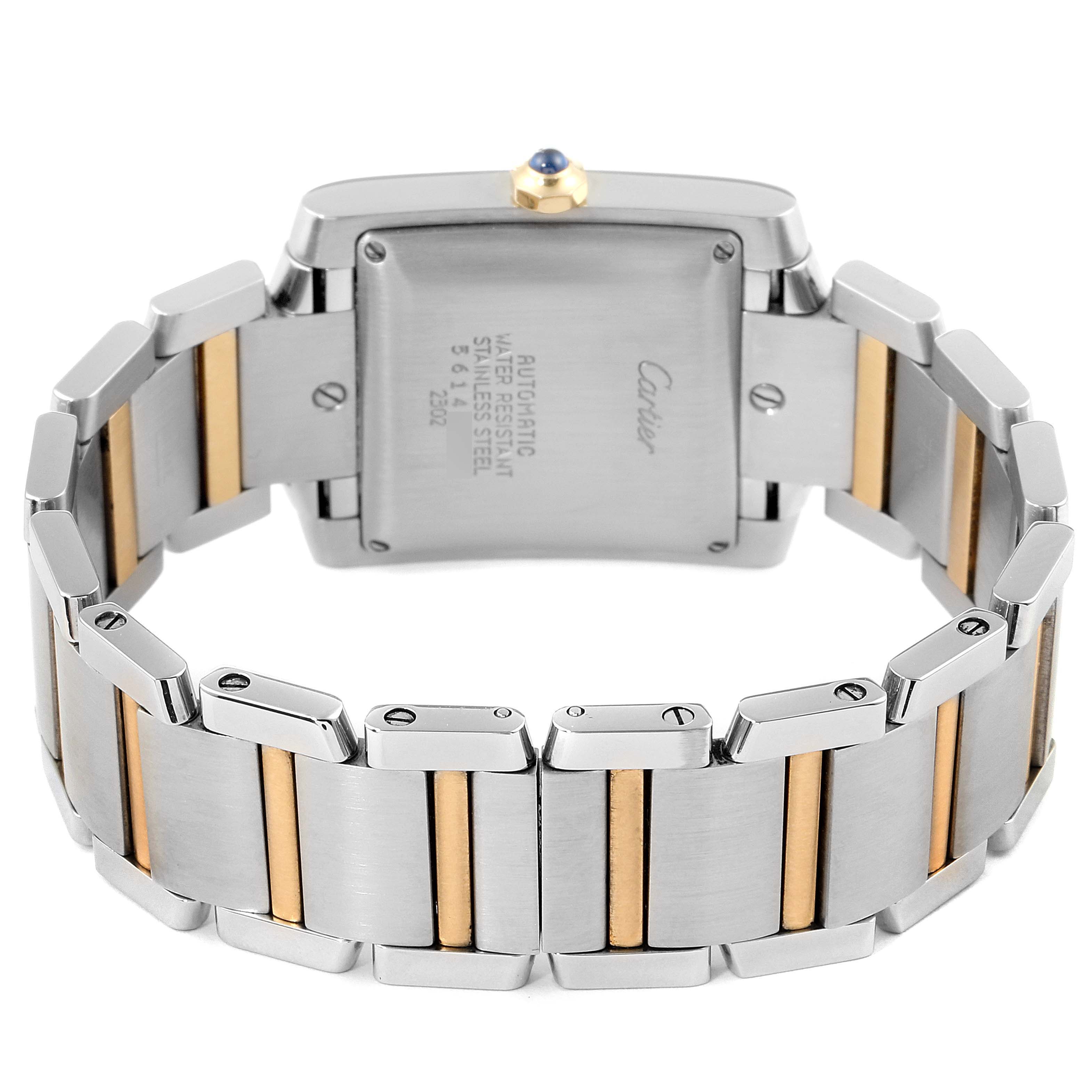 This image shows the back of the Cartier Tank Francaise W51005Q4 Men's Steel and Gold (two tone) Silver Dial W51005Q4 Men's Steel and Gold (two tone) Silver Dial watch and part of its stainless steel and gold bracelet.