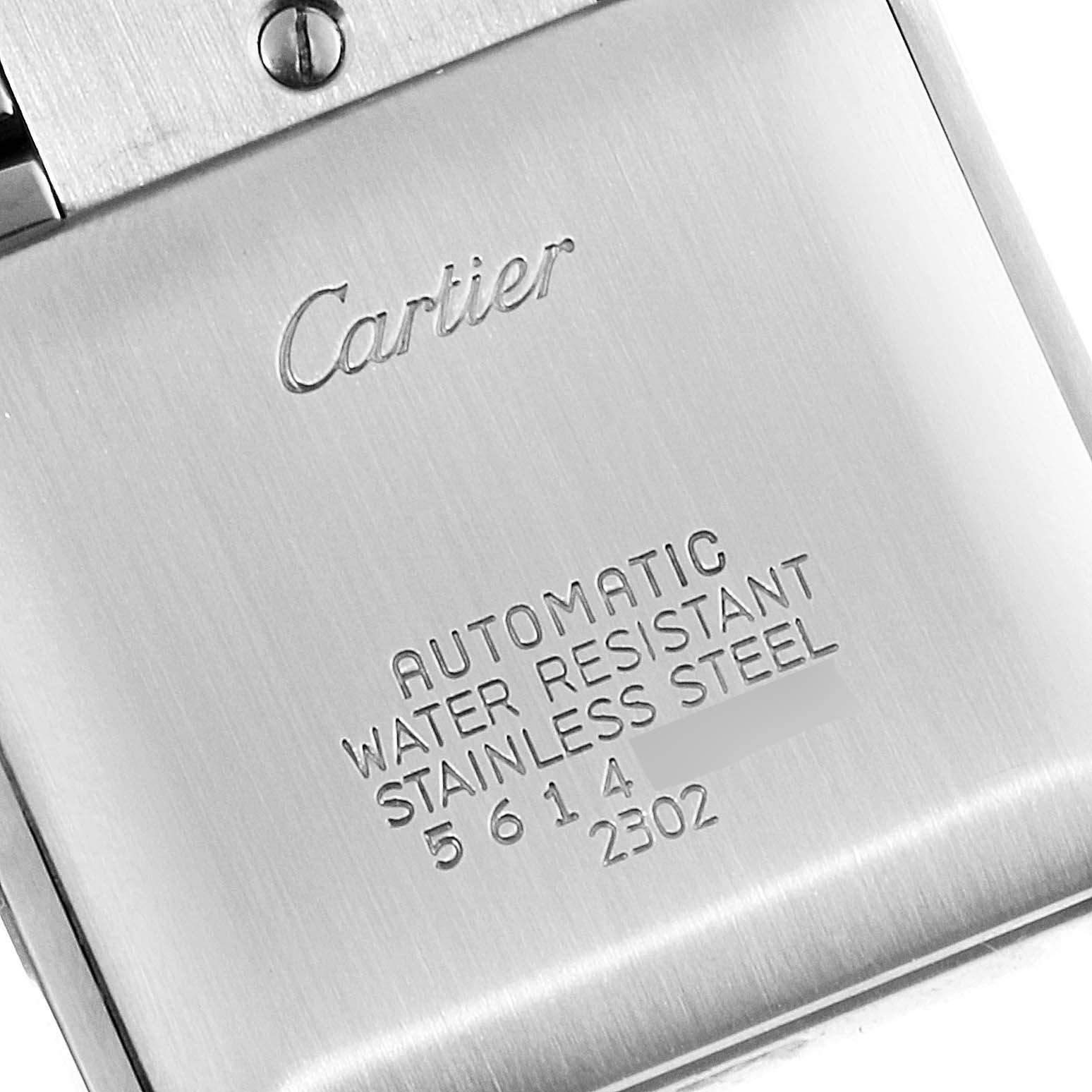 The image shows the engraved back case of a Cartier Tank Francaise W51005Q4 Men's Steel and Gold (two tone) Silver Dial W51005Q4 Men's Steel and Gold (two tone) Silver Dial watch, focusing on branding and specifications.