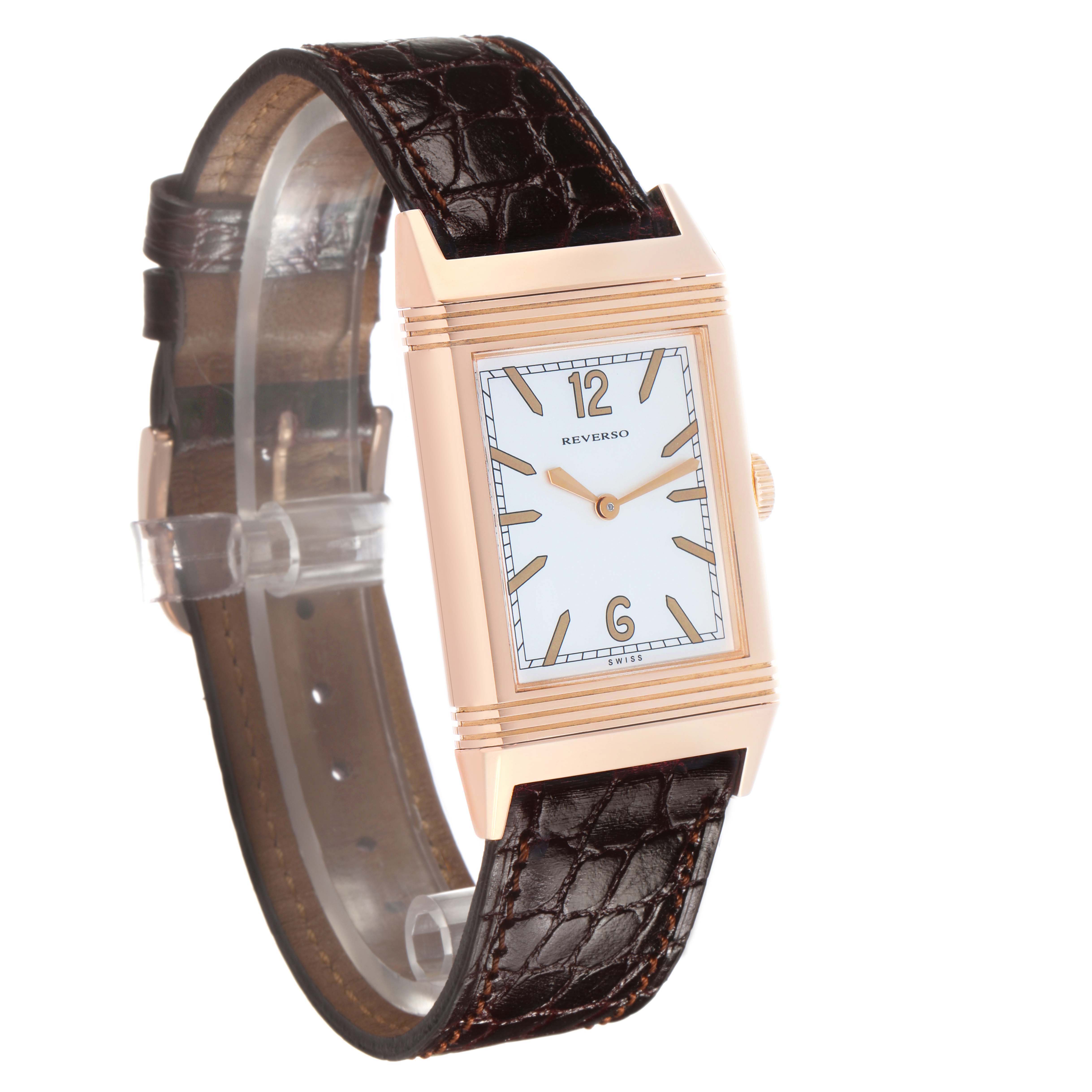 The Jaeger-LeCoultre Reverso watch is shown at a front left angle, displaying the face, case, strap, and crown.