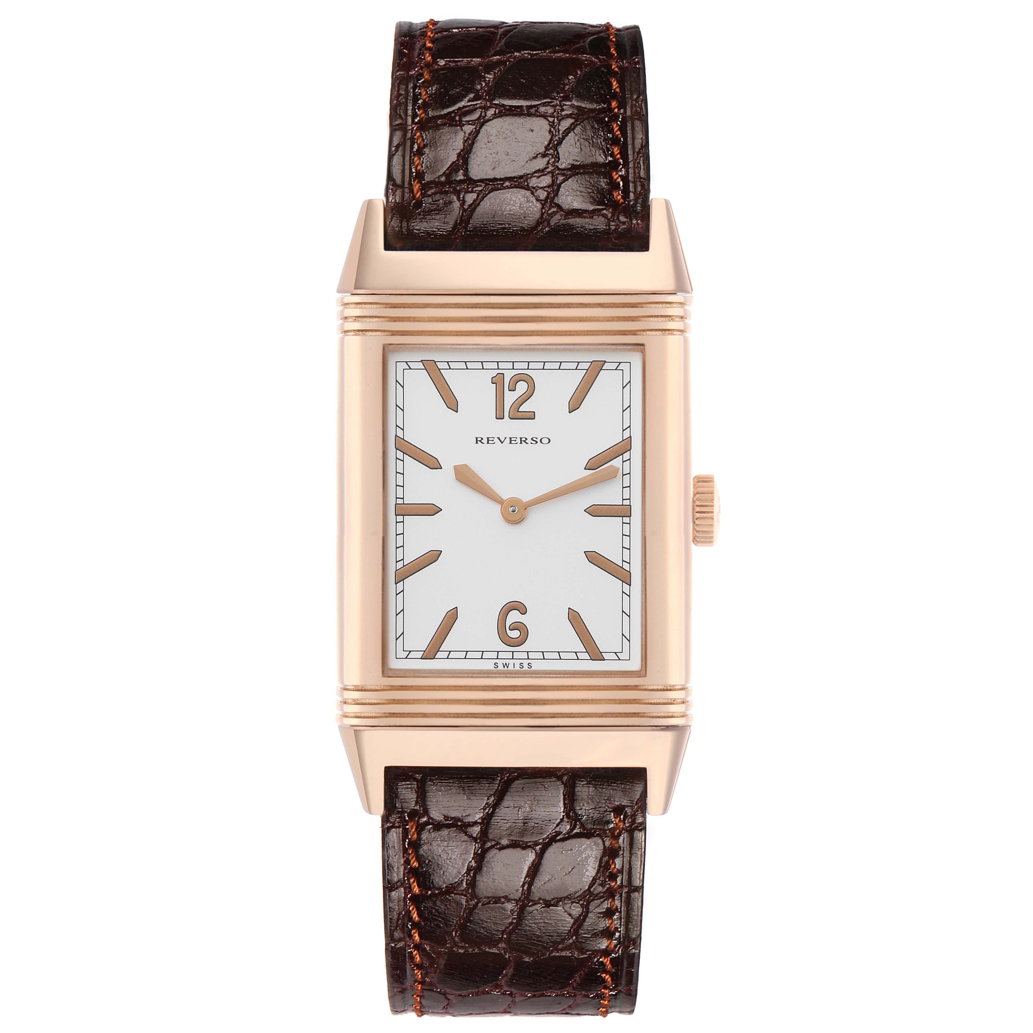 The Jaeger-LeCoultre Reverso watch is shown from the front, displaying the face, case, crown, and leather strap.