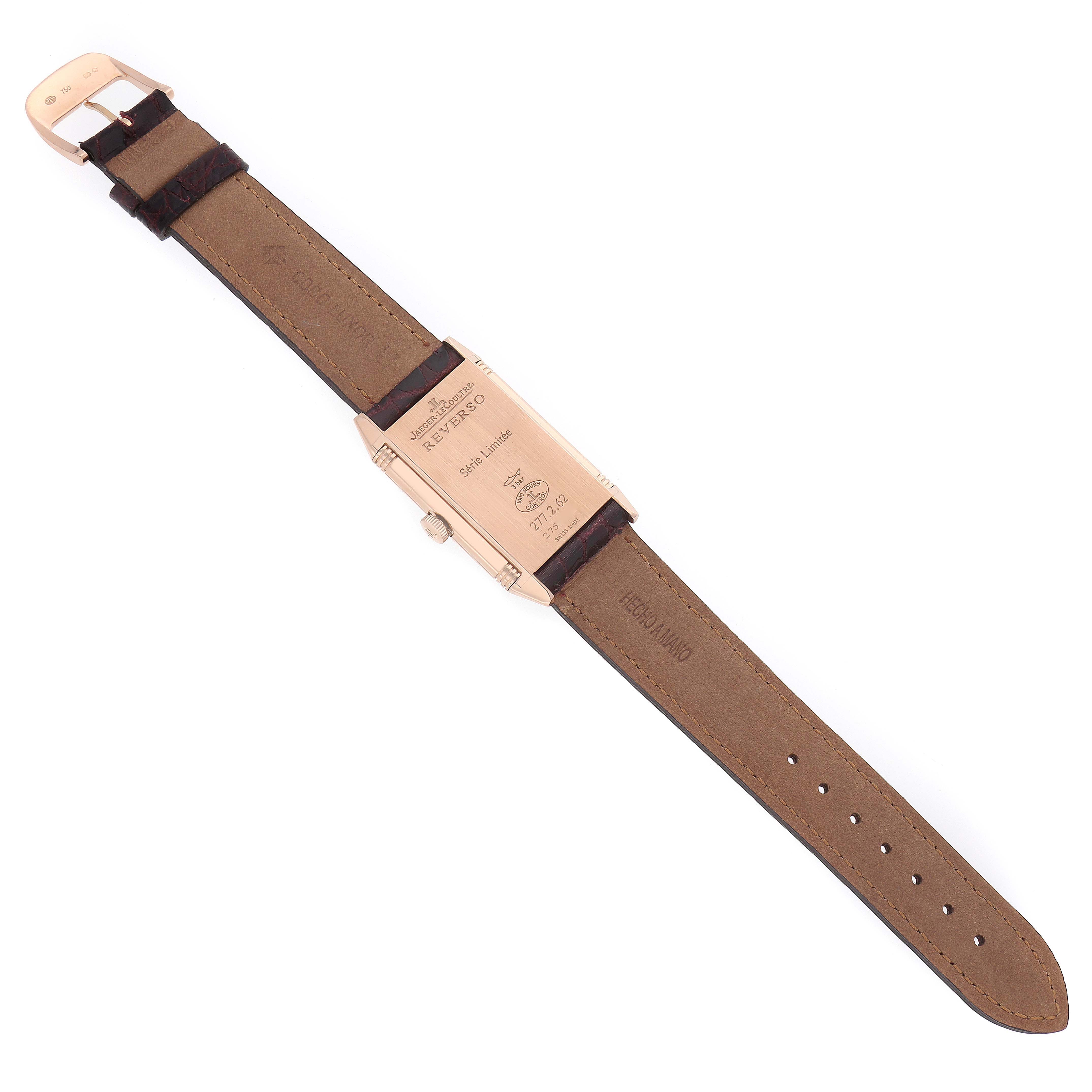 The image shows the back view of a Jaeger-LeCoultre Reverso watch lying flat, highlighting the case back and leather strap.