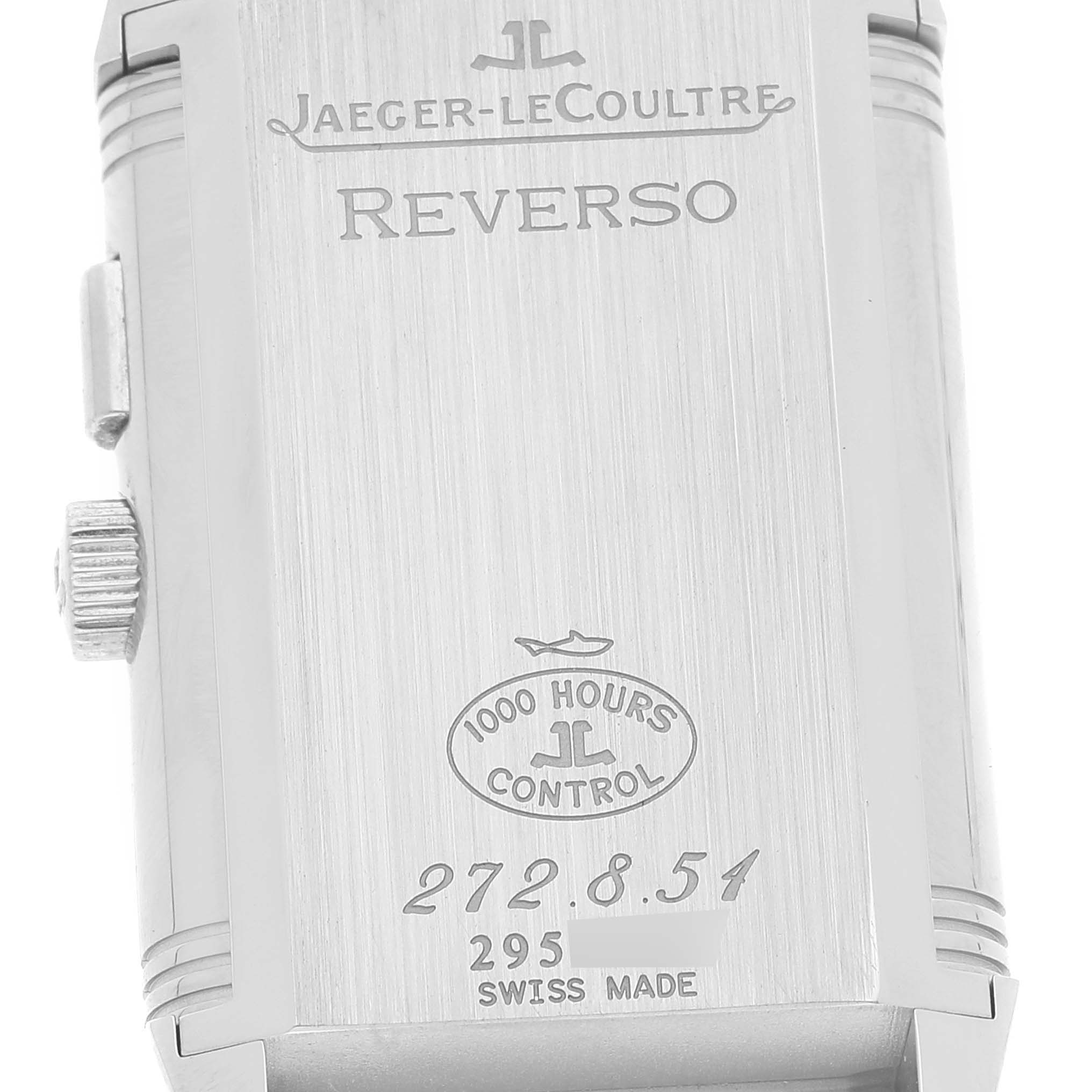 The image shows the back case of a Jaeger LeCoultre Reverso Q2718410 Men's Stainless Steel Silver Dial Q2718410 Men's Stainless Steel Silver Dial model watch with its engravings and crown partially visible.