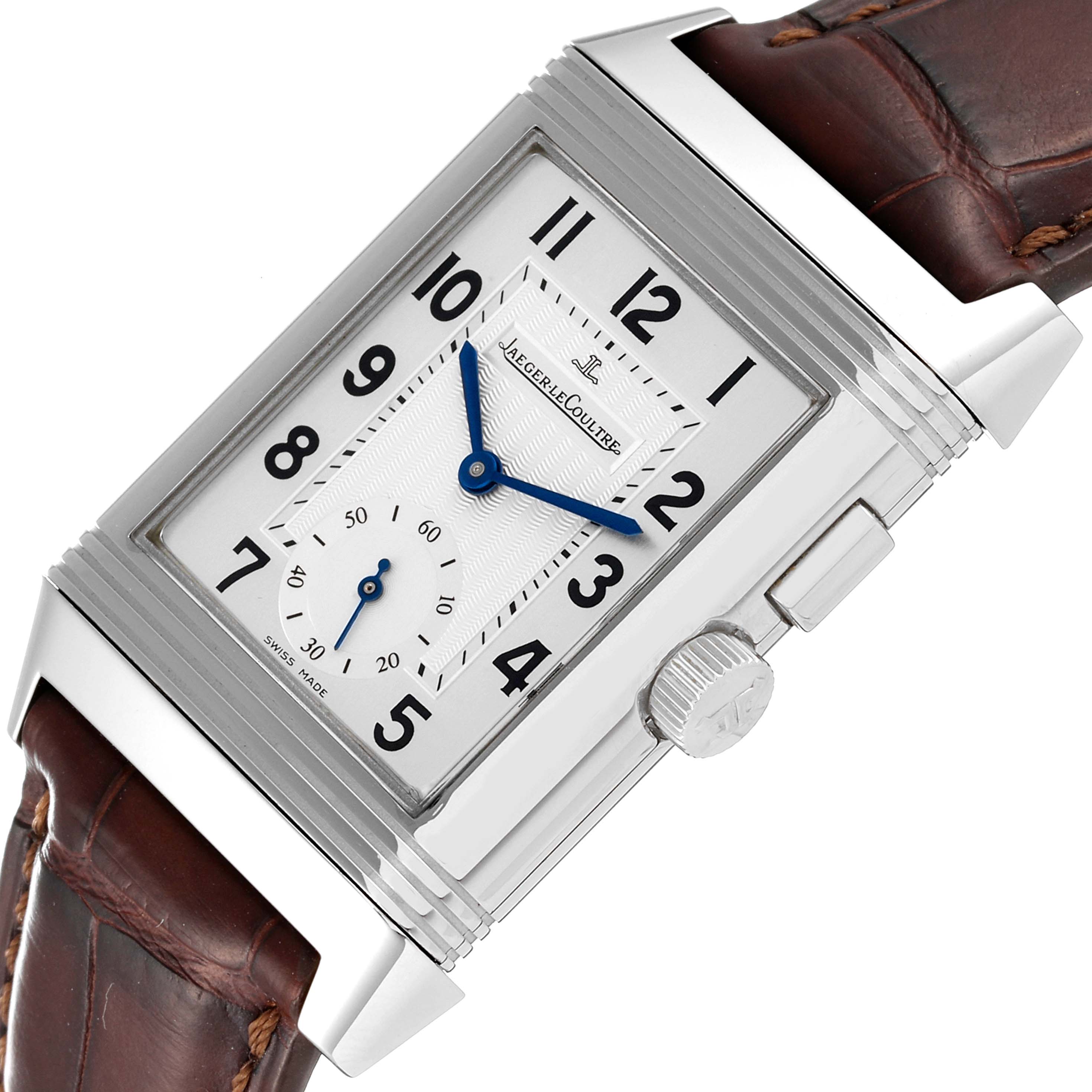 The image shows a close-up of the Jaeger LeCoultre Reverso Q2718410 Men's Stainless Steel Silver Dial Q2718410 Men's Stainless Steel Silver Dial watch face, crown, and part of the brown leather strap.