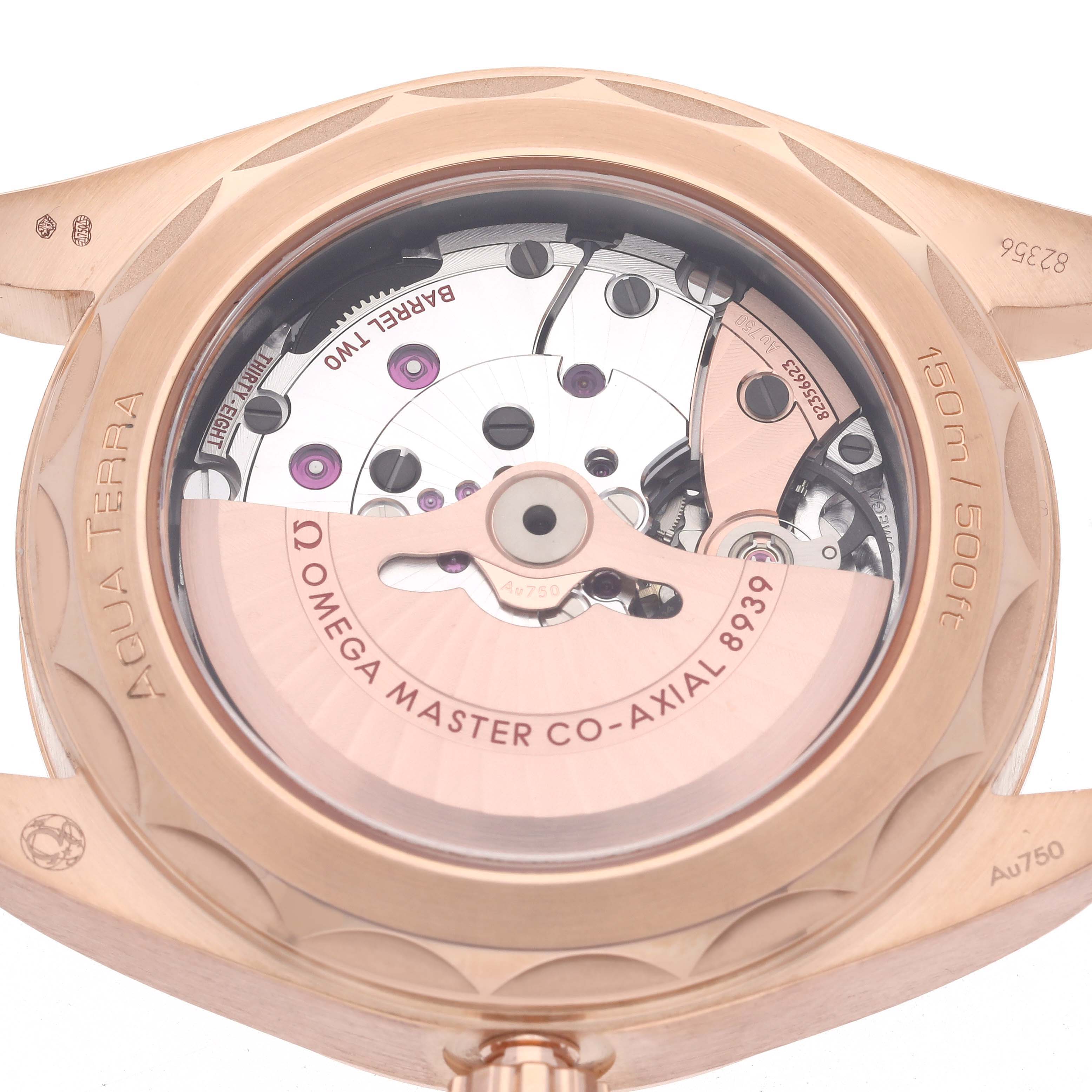 The Omega Aqua Terra 220.53.43.22.02.001 Men's Rose Gold Silver Dial 220.53.43.22.02.001 Men's Rose Gold Silver Dial watch is shown from the back, highlighting the movement and co-axial mechanism.