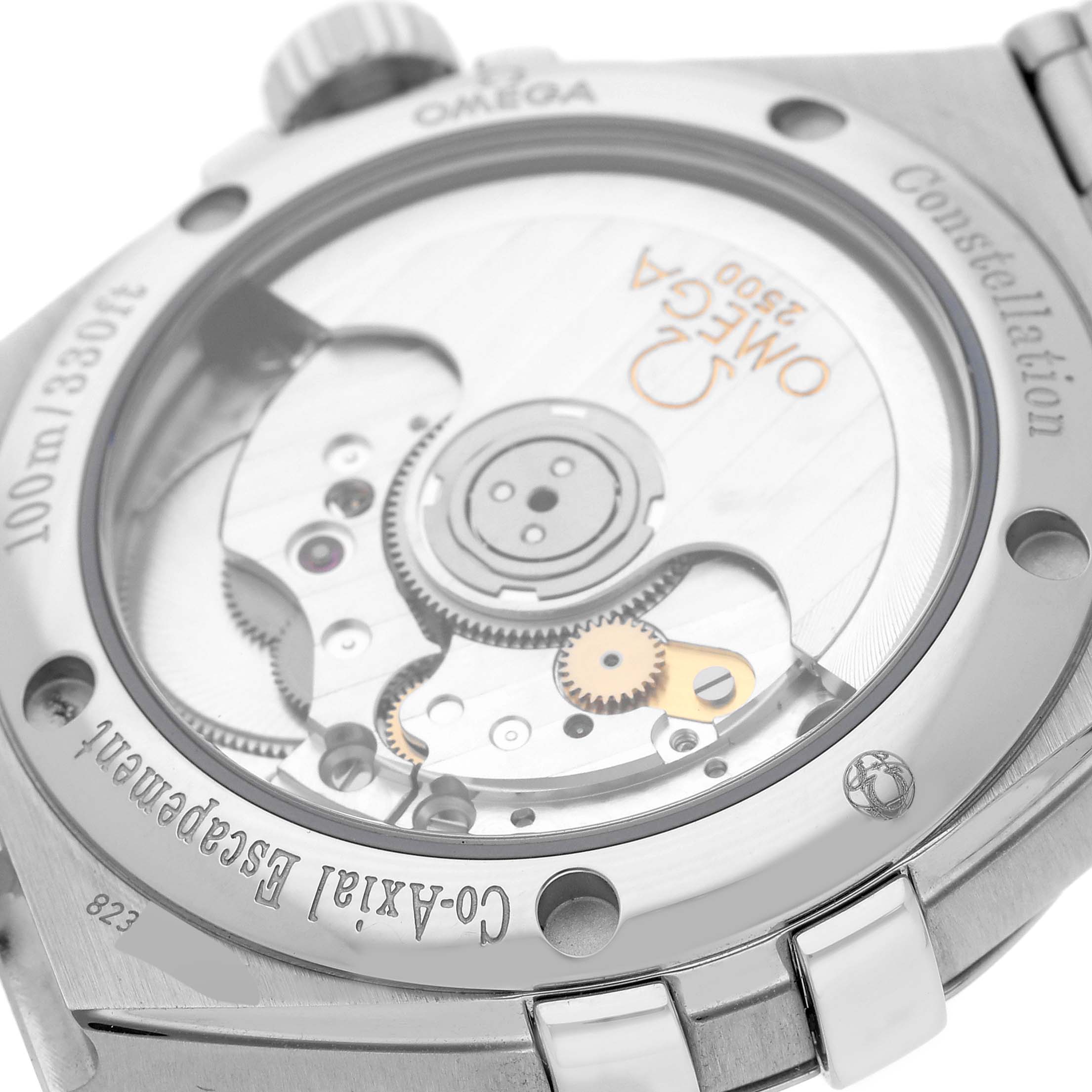 The image shows the back view of an Omega Constellation 123.10.35.20.03.002 Men's Stainless Steel Blue Dial 123.10.35.20.03.002 Men's Stainless Steel Blue Dial watch, highlighting the Co-Axial escapement and inner mechanical parts.