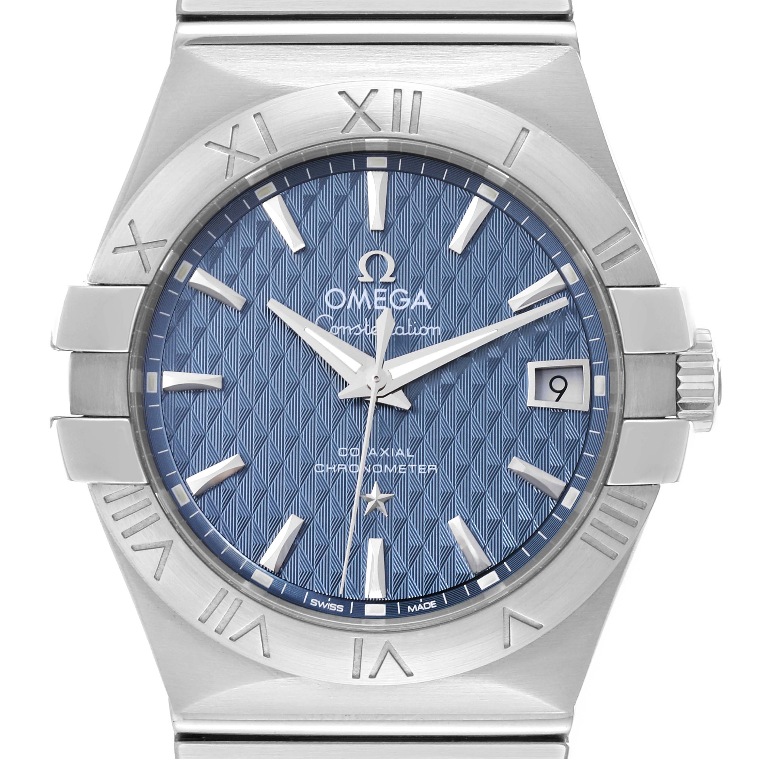 The image shows a close-up of the dial and bezel of an Omega Constellation 123.10.35.20.03.002 Men's Stainless Steel Blue Dial 123.10.35.20.03.002 Men's Stainless Steel Blue Dial watch, focusing on the blue patterned face and Roman numeral bezel.