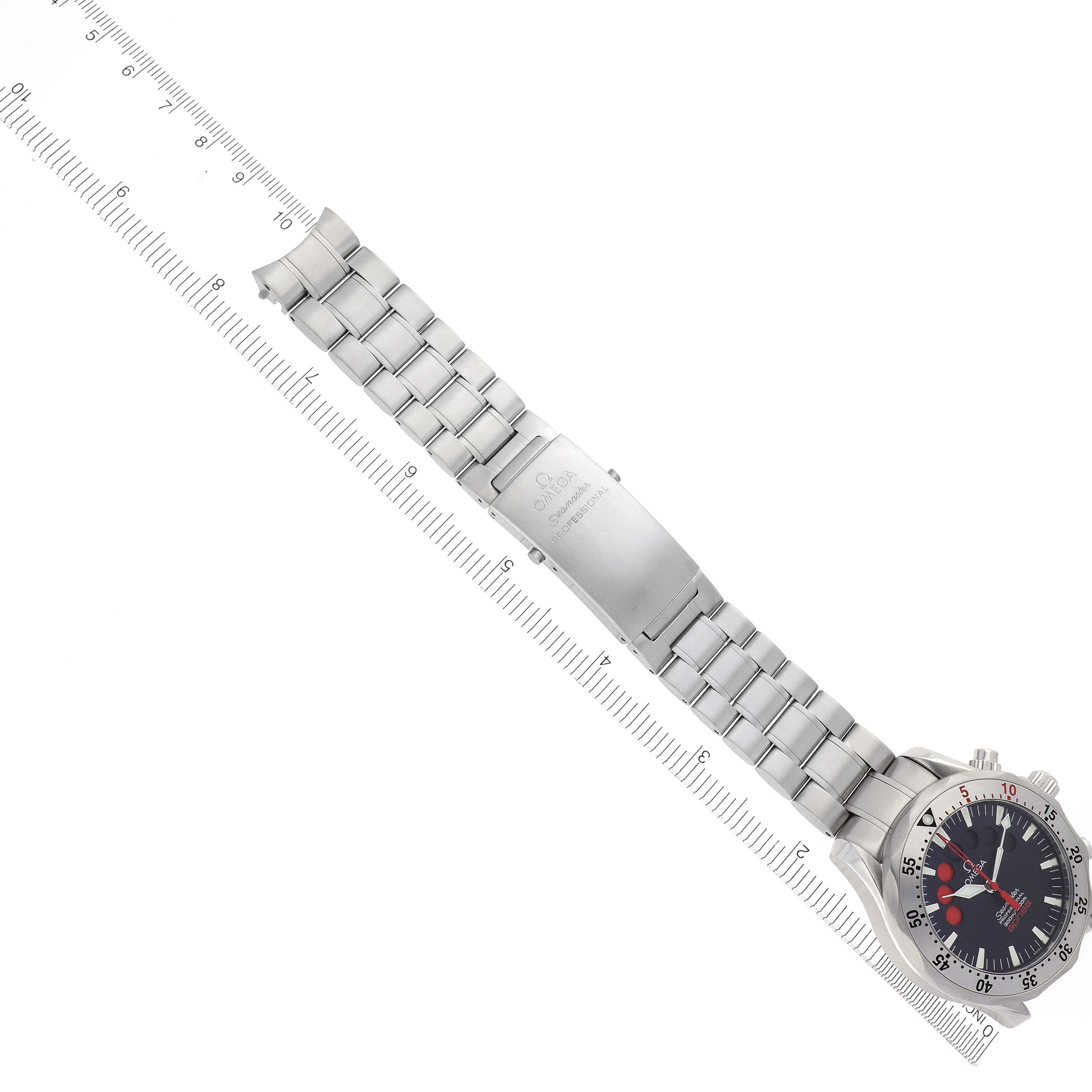 The Omega Seamaster 2595.50.00 Men's Stainless Steel Black Dial 2595.50.00 Men's Stainless Steel Black Dial watch is shown from an overhead angle, displaying its face, bracelet, and clasp beside a ruler.