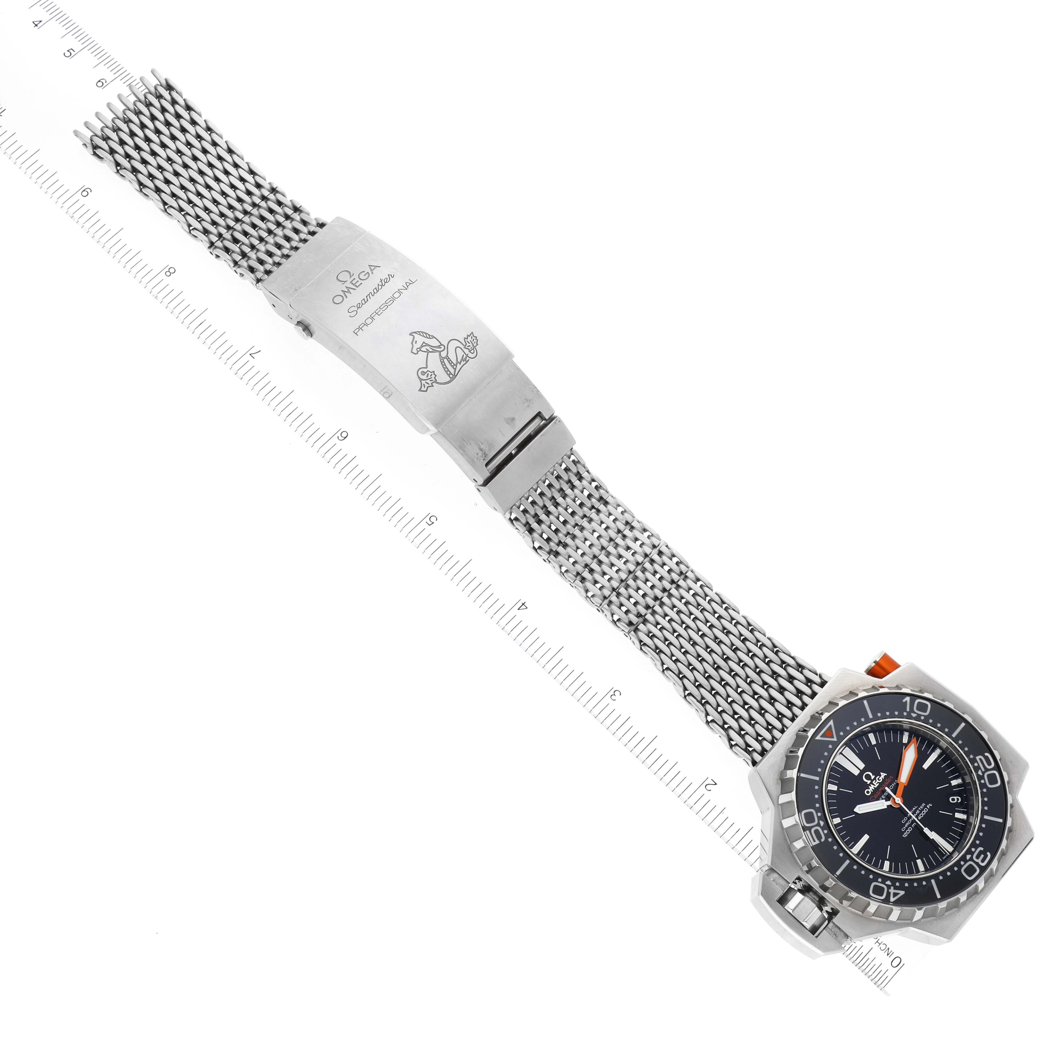 The Omega Ploprof 224.30.55.21.01.001 Men's Stainless Steel Black Dial 224.30.55.21.01.001 Men's Stainless Steel Black Dial watch is shown from an overhead view, displaying its dial, bezel, mesh strap, and clasp with branding.