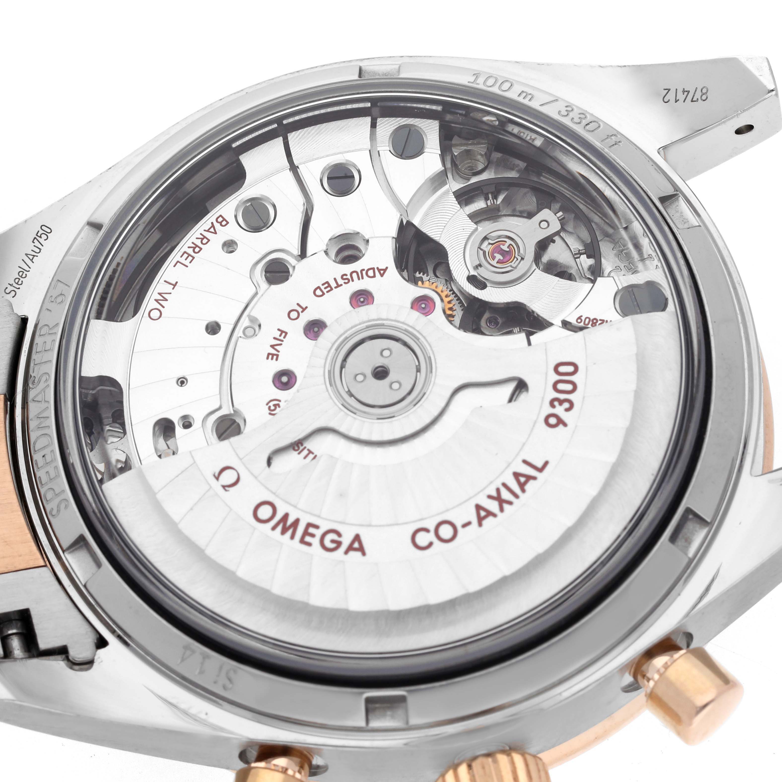 The image shows the back of the Omega Speedmaster 331.20.42.51.01.002 Men's Steel and Gold (two tone) Black Dial 331.20.42.51.01.002 Men's Steel and Gold (two tone) Black Dial, focusing on its Co-Axial 9300 movement.