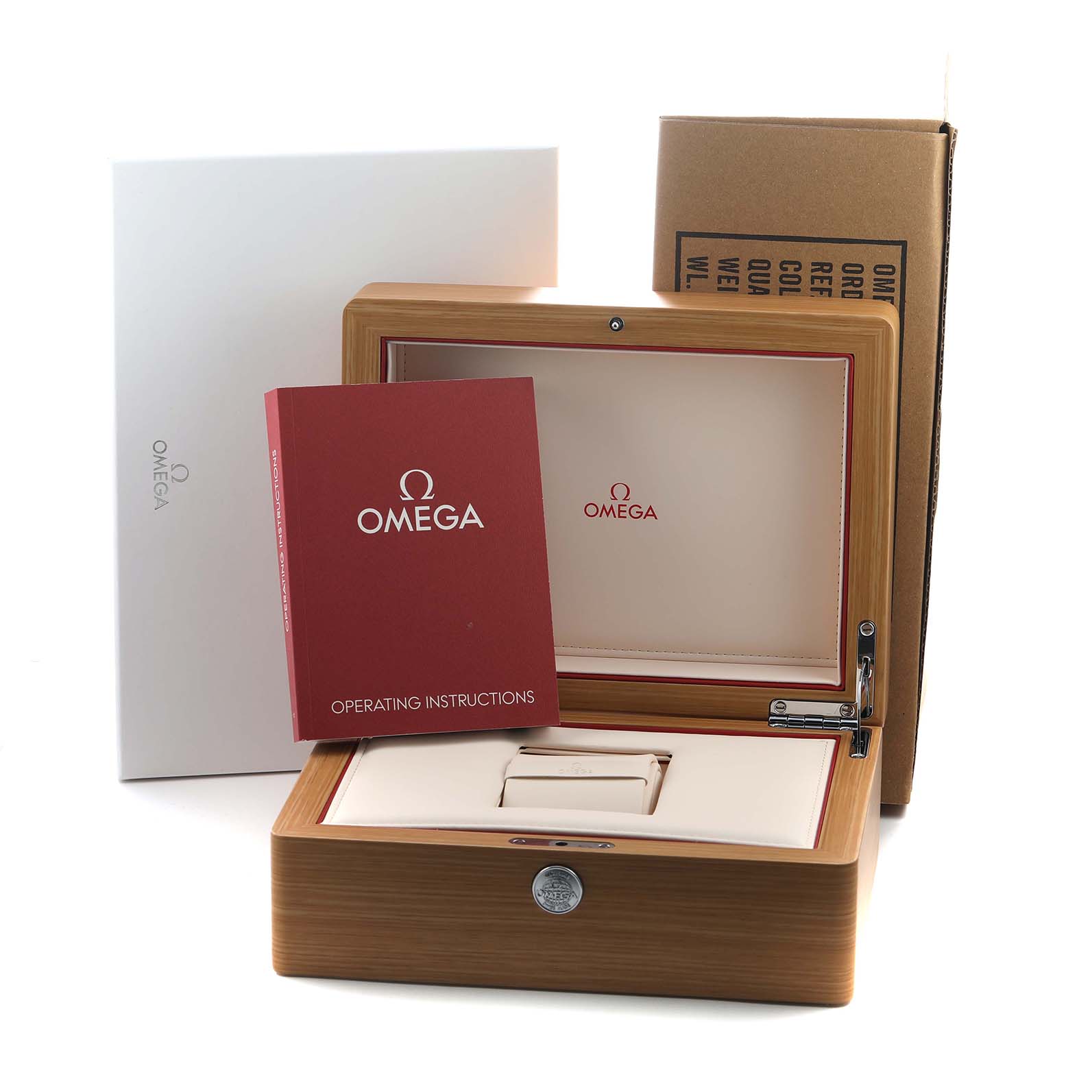 The image shows an Omega Speedmaster 311.30.42.30.99.001 Men's Stainless Steel Black Dial watch box, an operating instructions booklet, and packaging materials.