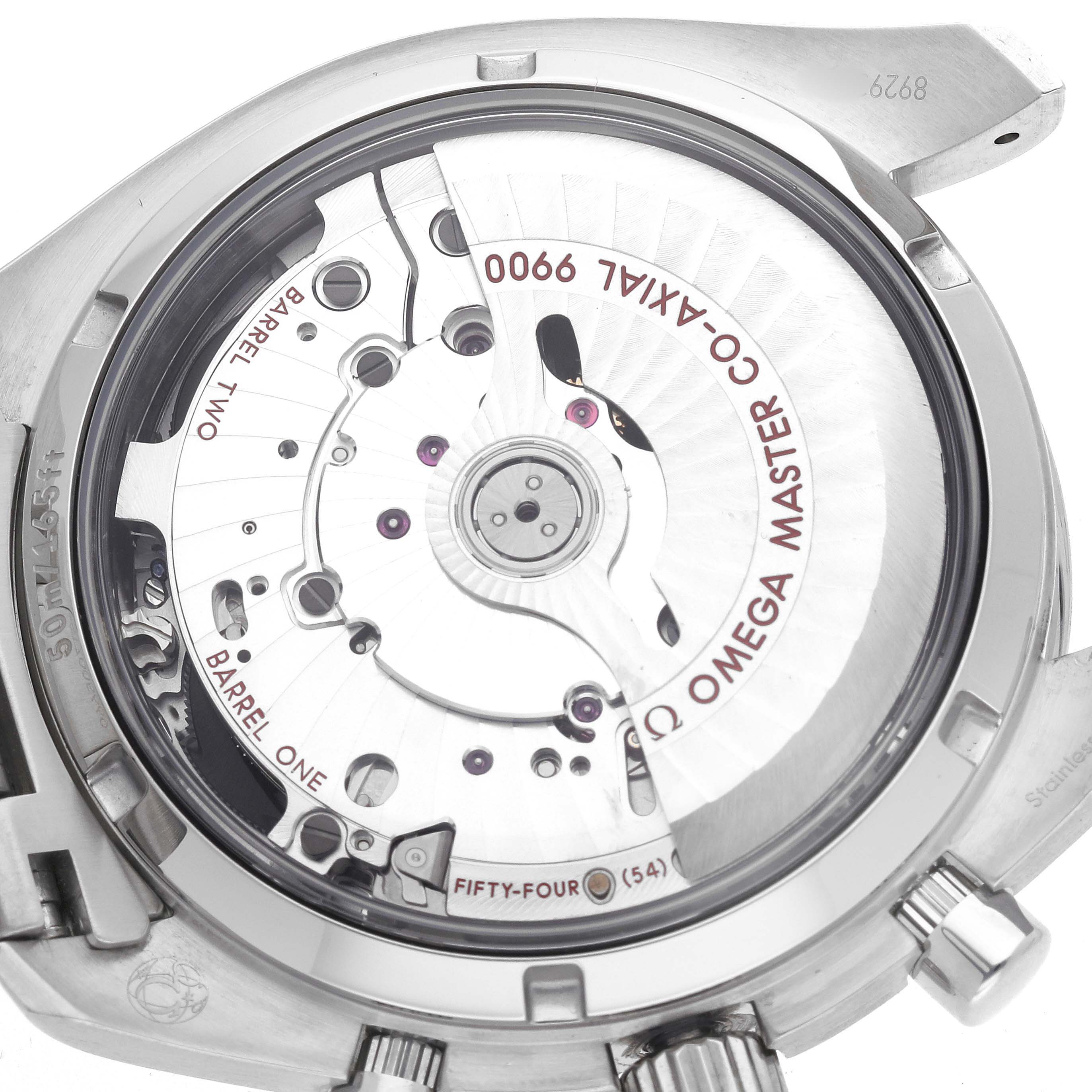 The image shows the backside of an Omega Speedmaster 329.30.44.51.04.001 Men's Stainless Steel Silver Dial, highlighting the open case back and the Co-Axial 9900 movement.