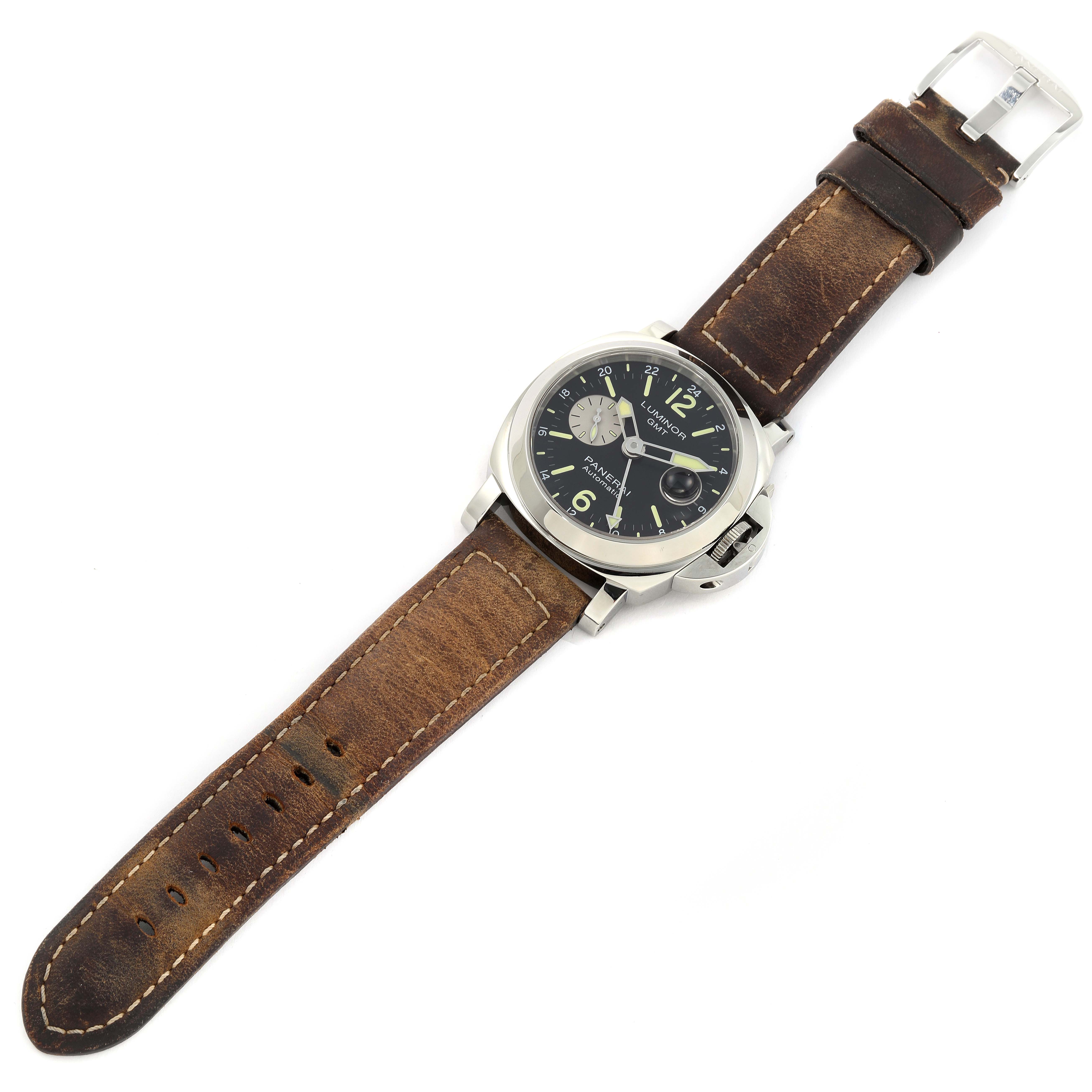 The image shows a Panerai Luminor PAM01088 Men
s Stainless Steel Black Dial PAM01088 Men
s Stainless Steel Black Dial watch from a top-down angle, highlighting its face and brown leather strap.