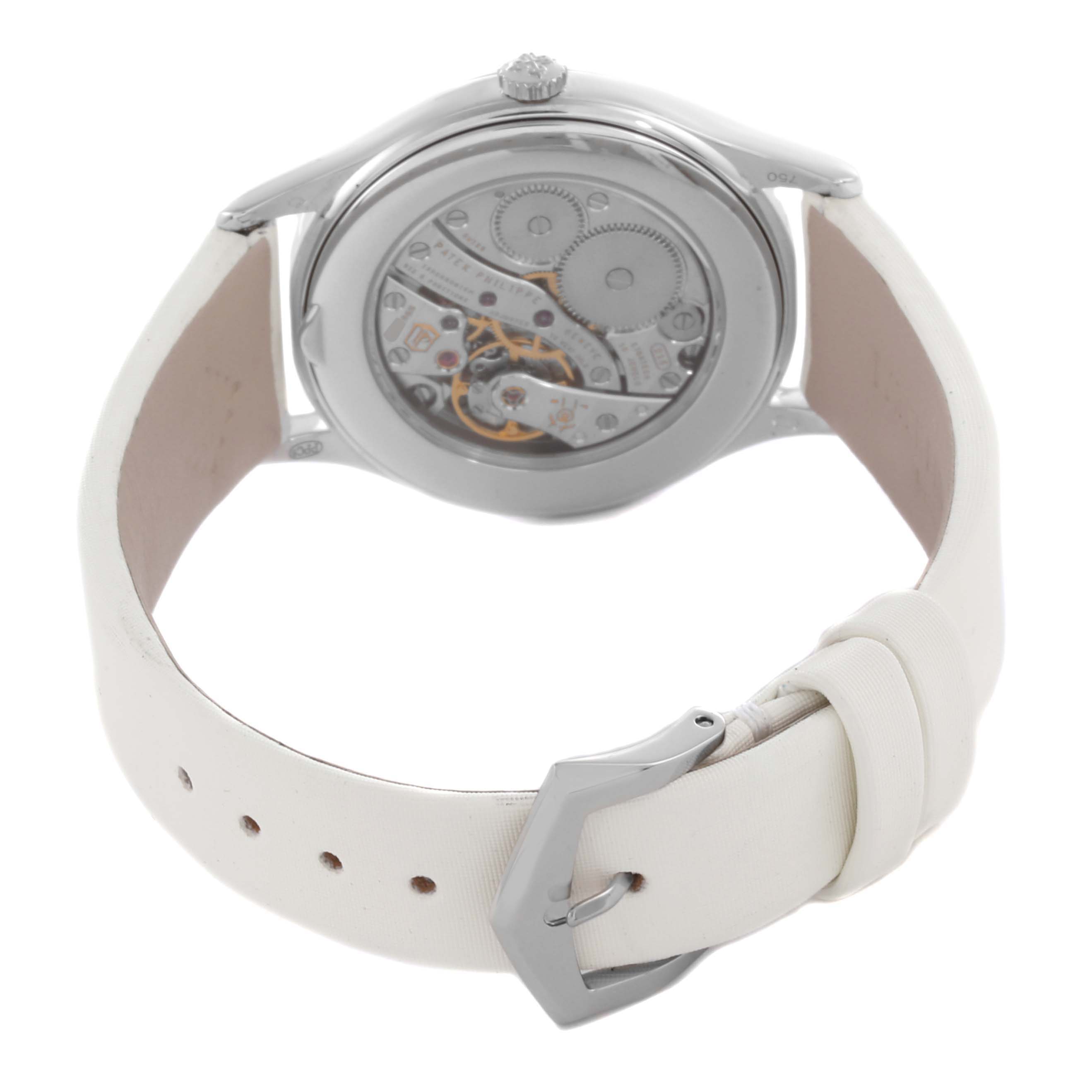 The image shows the back view of a Patek Philippe Calatrava 4897G Women's White Gold Grey Dial 4897G Women's White Gold Grey Dial watch, highlighting the movement and white leather strap.