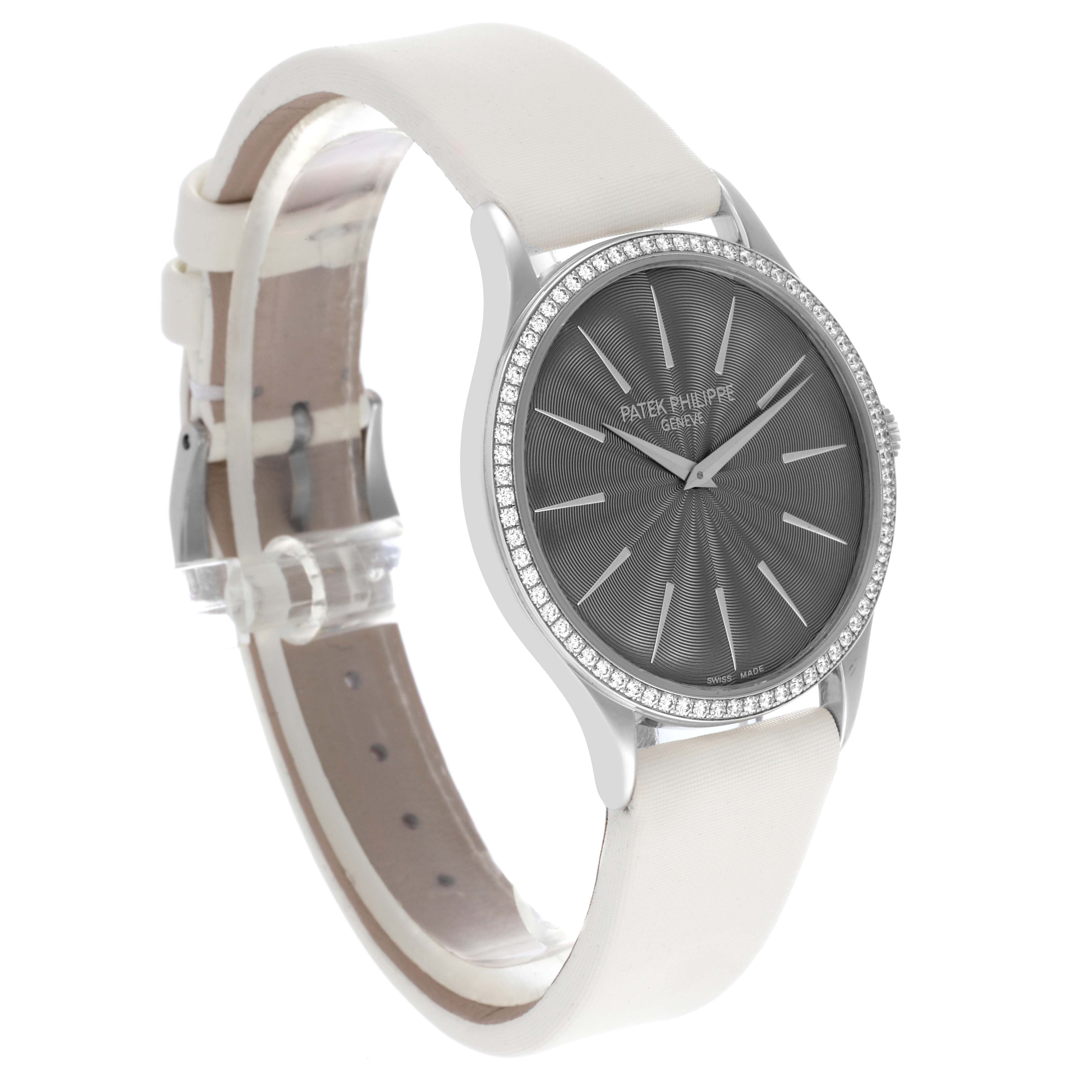 The Patek Philippe Calatrava 4897G Women's White Gold Grey Dial 4897G Women's White Gold Grey Dial watch is shown at a 3/4 angle, highlighting the face, bezel, and strap.