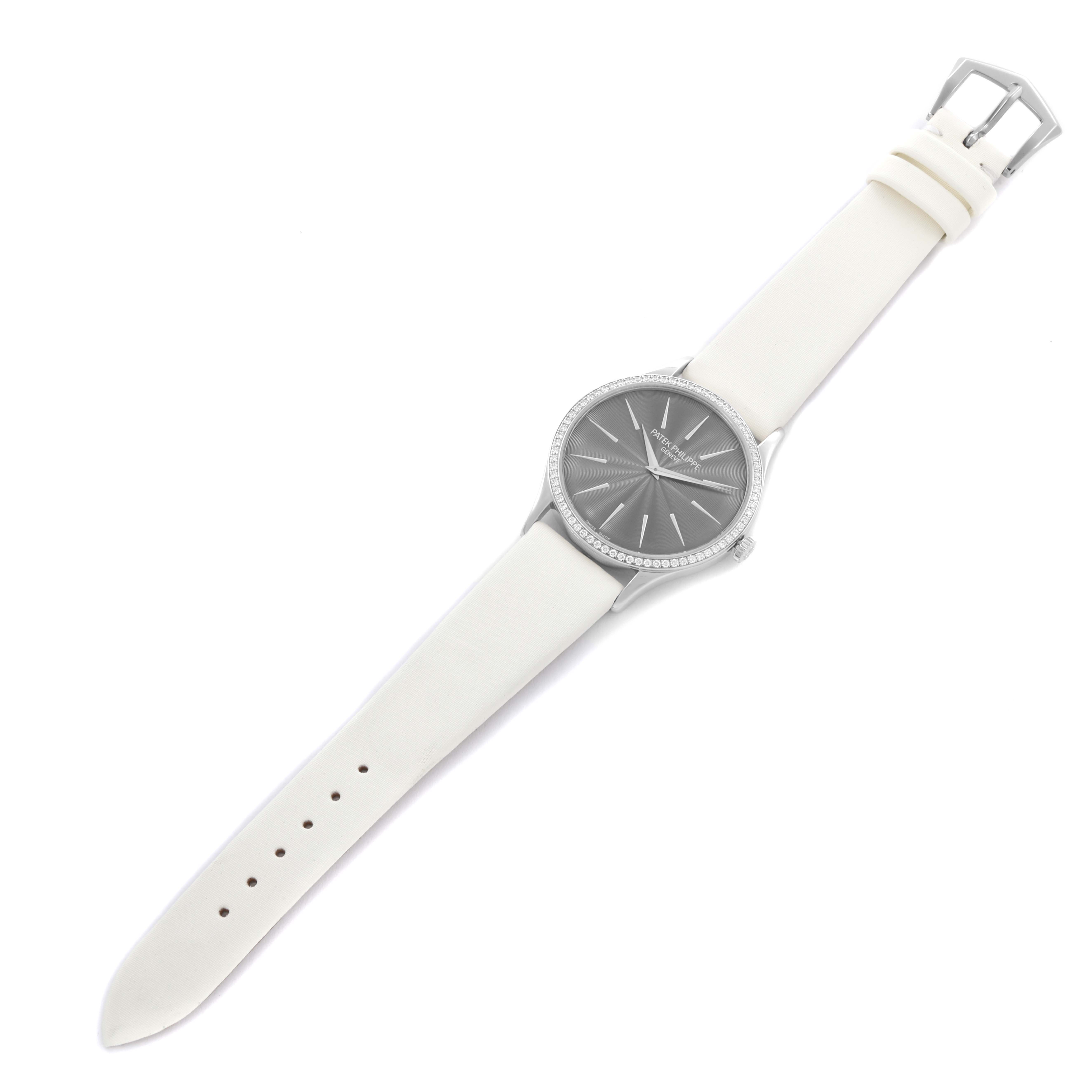 The Patek Philippe Calatrava 4897G Women's White Gold Grey Dial 4897G Women's White Gold Grey Dial watch is shown from an overhead angle, displaying the full face, bezel, and white strap.