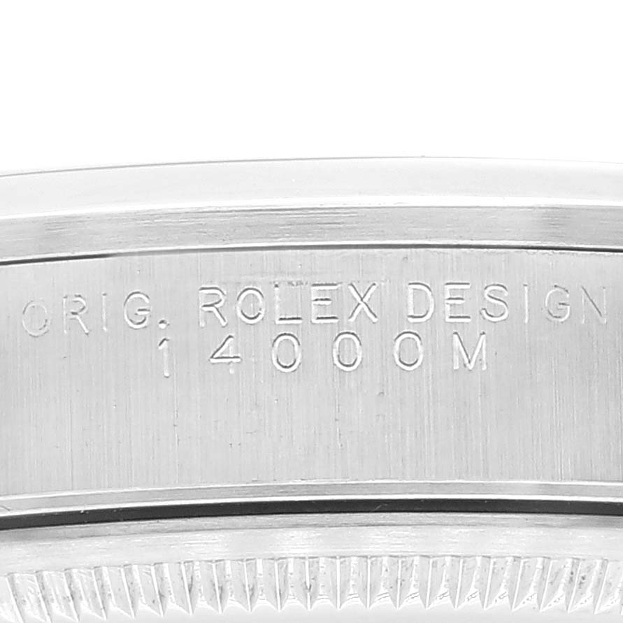 This close-up image shows the engraved inner bezel of the Rolex Air-King 14000 Men's Stainless Steel Silver Dial 14000 Men's Stainless Steel Silver Dial watch with "14000M" and "ORIG. ROLEX DESIGN" inscriptions.