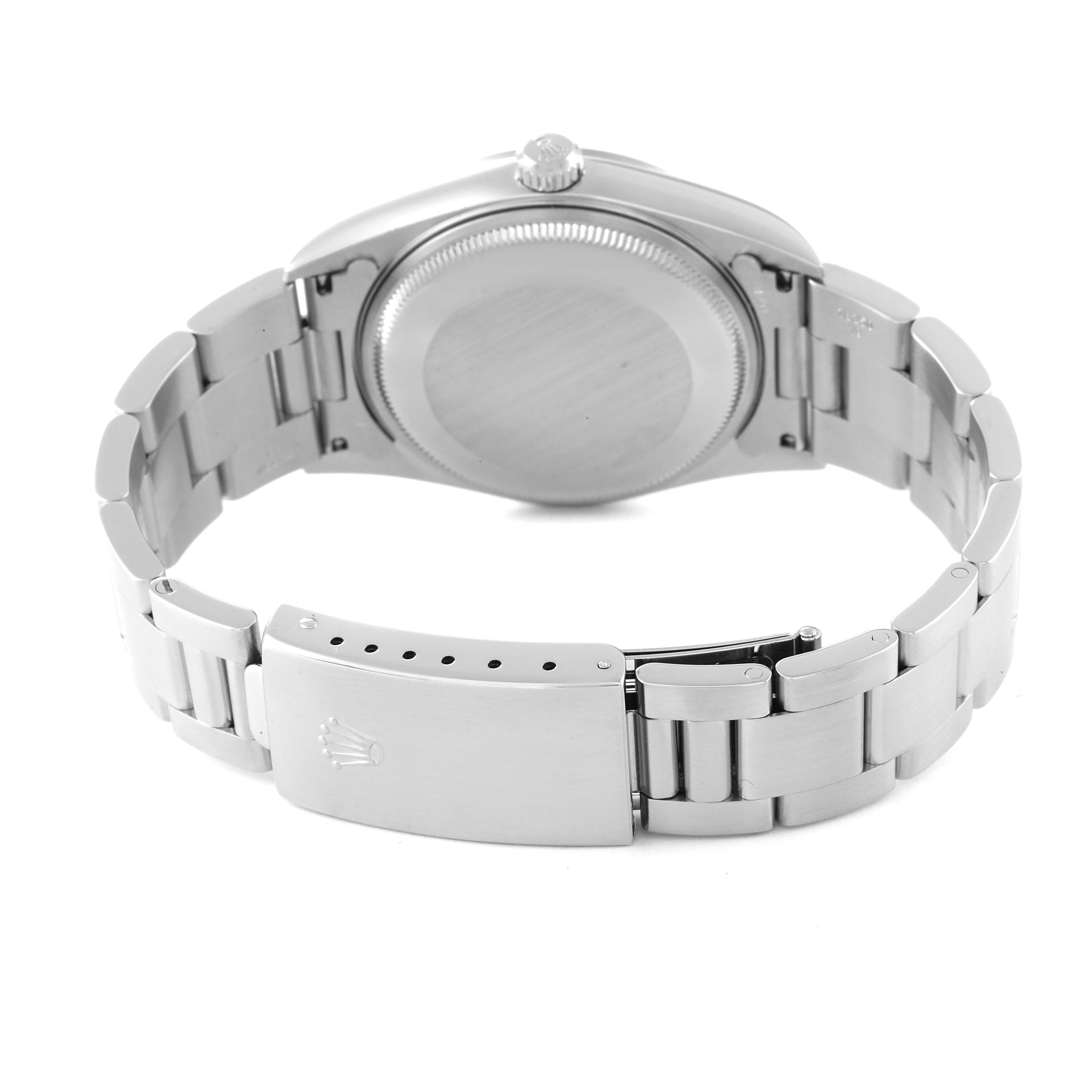 The image shows the back view of a Rolex Air-King 14000 Men's Stainless Steel Silver Dial 14000 Men's Stainless Steel Silver Dial watch, highlighting its metal bracelet and closed clasp.